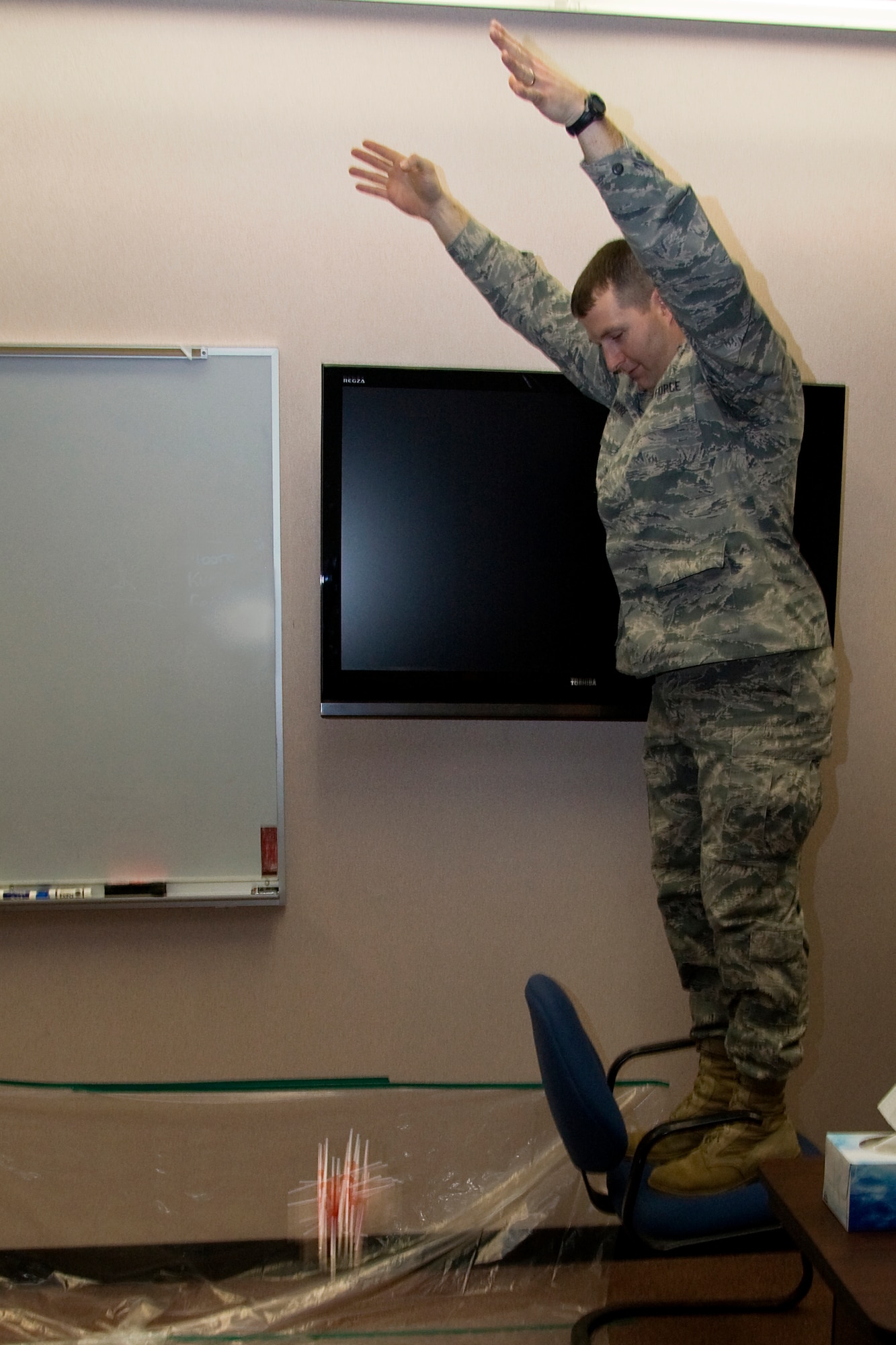 GRISSOM AIR RESERVE BASE, Ind. -- Master Sgt. Nathan Moore, 434th Airman and Family Readiness office noncommissioned officer in charge, drops an egg during a team-building activity that took place as part of Wingman Day here March 6. Airmen from the 434th Air Refueling Wing participated in a three-hour training session that focused on building Airmen resiliency and overall unit cohesion. Sergeant Moore was one of the facilitators for the Airman from the 434th Force Support Squadron. The egg drop competition was aimed at building teamwork and fostering good communication within units. (U.S. Air Force photo/Tech. Sgt. Mark R. W. Orders-Woempner)
