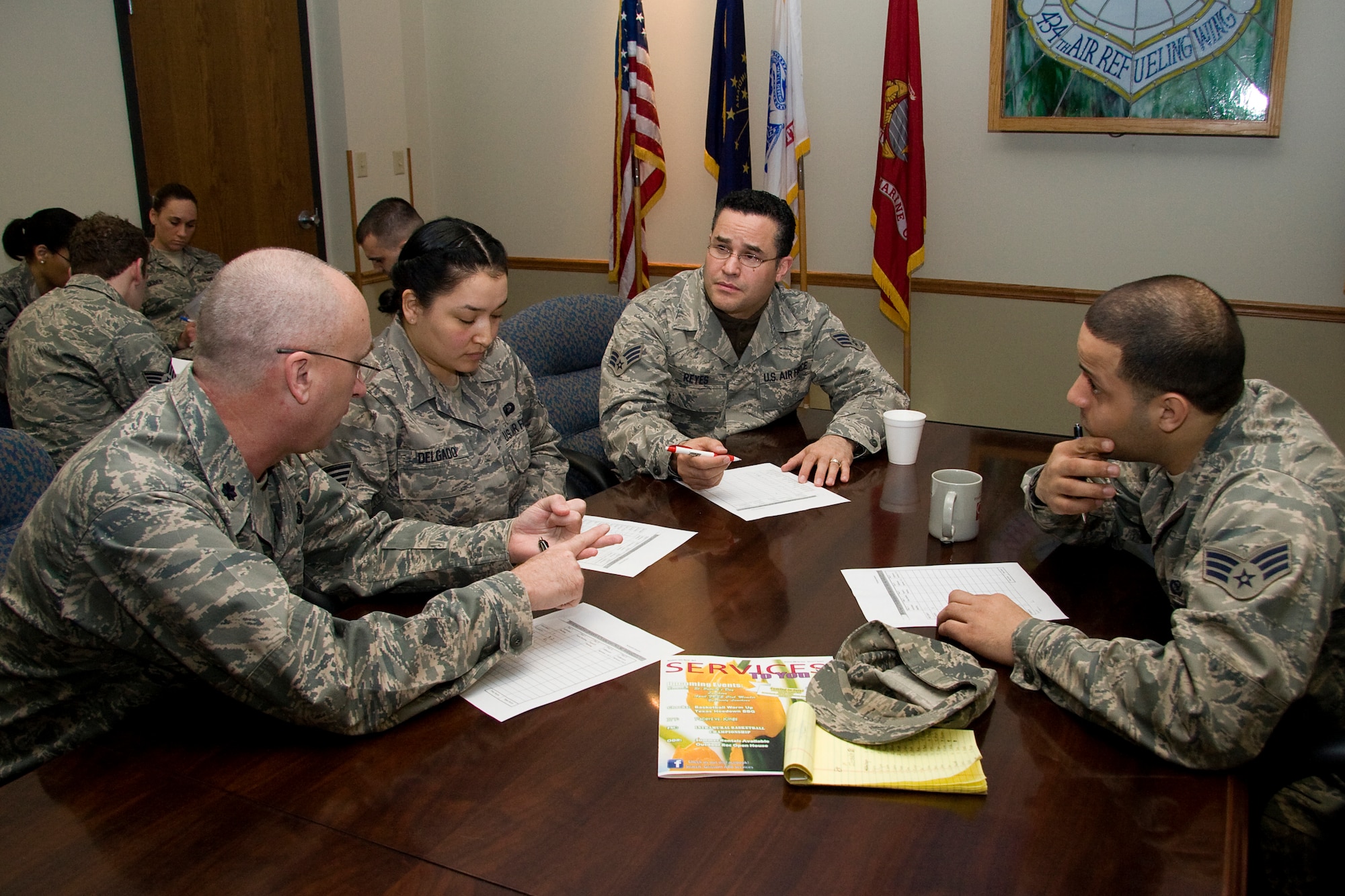 GRISSOM AIR RESERVE BASE, Ind. -- Lt. Col. Charles Cooper works with Staff Sergeant Gisel Delgado and Senior Airmen Wilson Reyes and Carl Berry during a team building exercise held as part of Wingman Day here March 6. The three-hour training held focused on building Airman resiliency and overall unit cohesion. Colonel Cooper is the financial management chief, Sergeant Delgado is a finance technician, Airman Reyes is a chaplains assistant and Airman Berry is a public affairs specialist. All Airmen pictured are part of the 434th Air Refueling Wing staff. (U.S. Air Force photo/Tech. Sgt. Mark R. W. Orders-Woempner)
