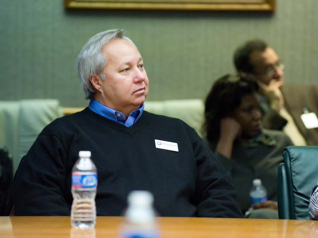 Bill Klemkowski, 512th Maintenance Squadron, listens to a briefing about the difference between a C-5 and a C-5M during a 101 Brief and Tour Feb. 15 on Dover Air Force Base, Del. Mr. Klemkowski is the chairman of the board of the Rehoboth Beach-Dewey Beach Chamber of Commerce. (U.S. Air Force photo by Jason Minto/Released)