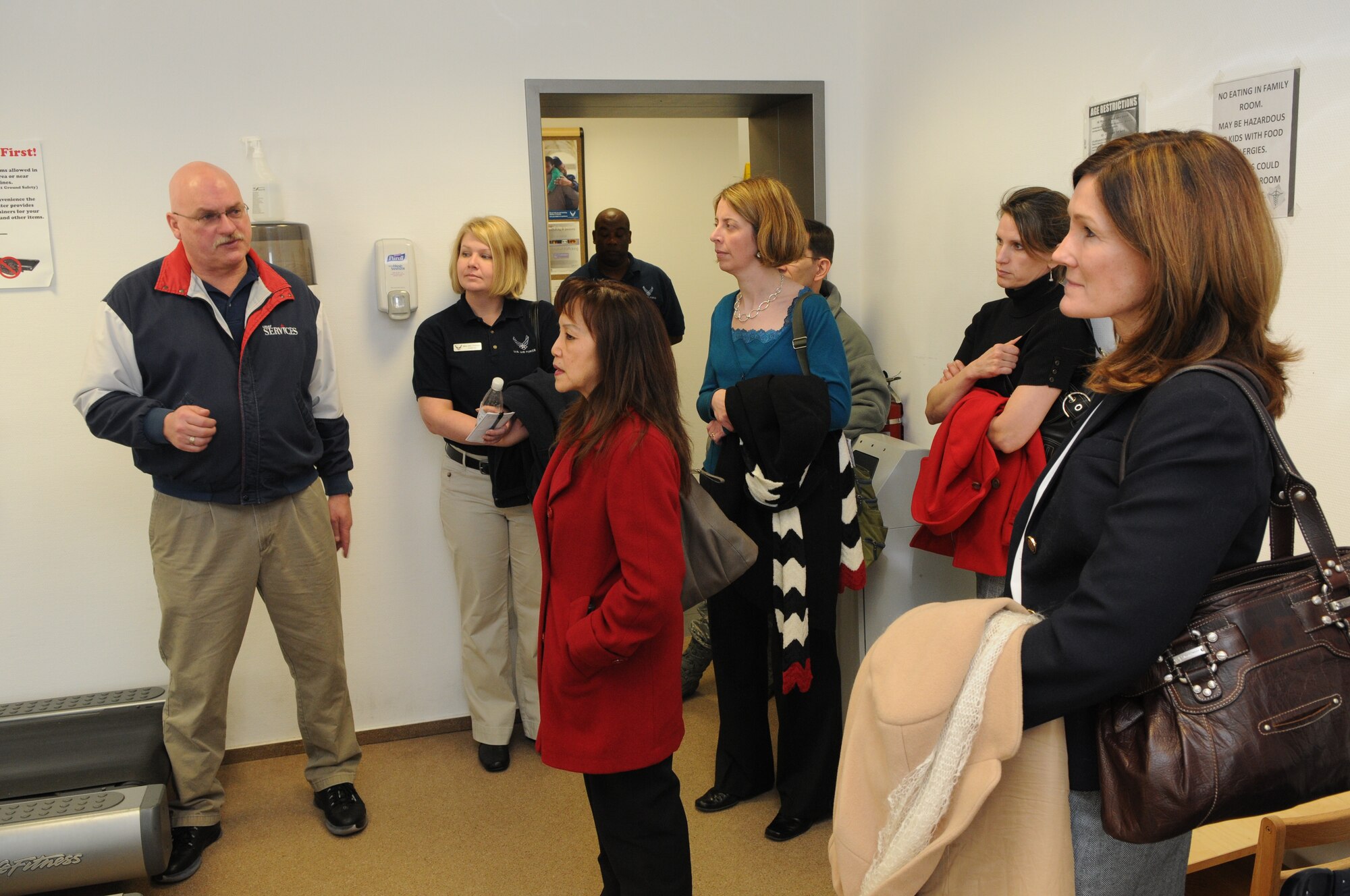 SPANGDAHLEM AIR BASE, Germany –Mark Geairn, 52nd Force Support Squadron fitness director, talks with Betty Welsh, wife of U.S Air Forces in Europe Commander Gen. Mark A. Welsh III, and Mary Williamson, wife of USAFE Command Chief Master Sgt. David W. Williamson, about different programs offered by the fitness center here March 3. General Welsh assumed command of USAFE in December 2010, and visited Spangdahlem Air Base with Chief Williamson and their wives to get a better understanding of the 52nd Fighter Wing’s mission and Airmen. (U.S. Air Force photo/Airman 1st Class Matthew B. Fredericks)