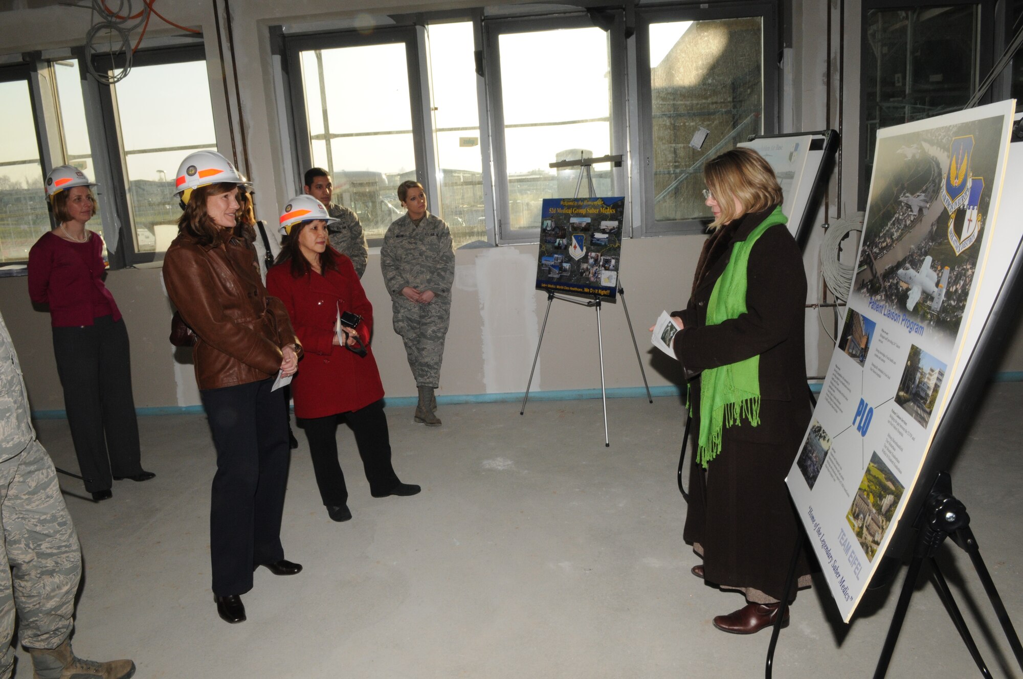SPANGDAHLEM AIR BASE, Germany – Simone Harcarik, 52nd Medical Support Squadron TRICARE patient liaison officer, talks with Betty Welsh, wife of U.S. Air Forces in Europe Commander Gen. Mark A. Welsh III, and Mary Williamson, wife of USAFE Command Chief Master Sgt. David W. Williamson, about the medical clinic being constructed on Spangdahlem Air Base March 3. General Welsh assumed command of USAFE in December 2010, and visited Spangdahlem AB with Chief Williamson and their wives to get a better understanding of the 52nd FW’s mission and Airmen. (U.S. Air Force photo/Airman 1st Class Matthew B. Fredericks)