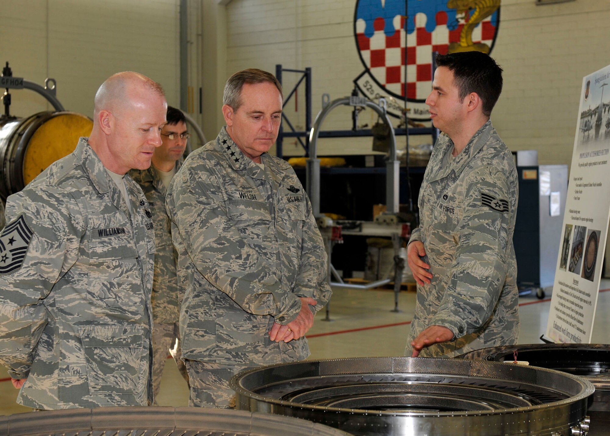 SPANGDAHLEM AIR BASE, Germany— Staff Sgt. Patrick Deluca, 52nd Component Maintenance Squadron, briefs Gen. Mark A. Welsh III, U.S. Air Forces in Europe commander, and Chief Master Sgt. David Williamson, USAFE command chief, about propulsion and the 52nd CMS role here March 1. The USAFE leaders visited various facilities at Spangdahlem AB to gain a better understanding of the 52nd Fighter Wing. (U.S. Air Force photo/Airman 1st Class Brittney Frees)