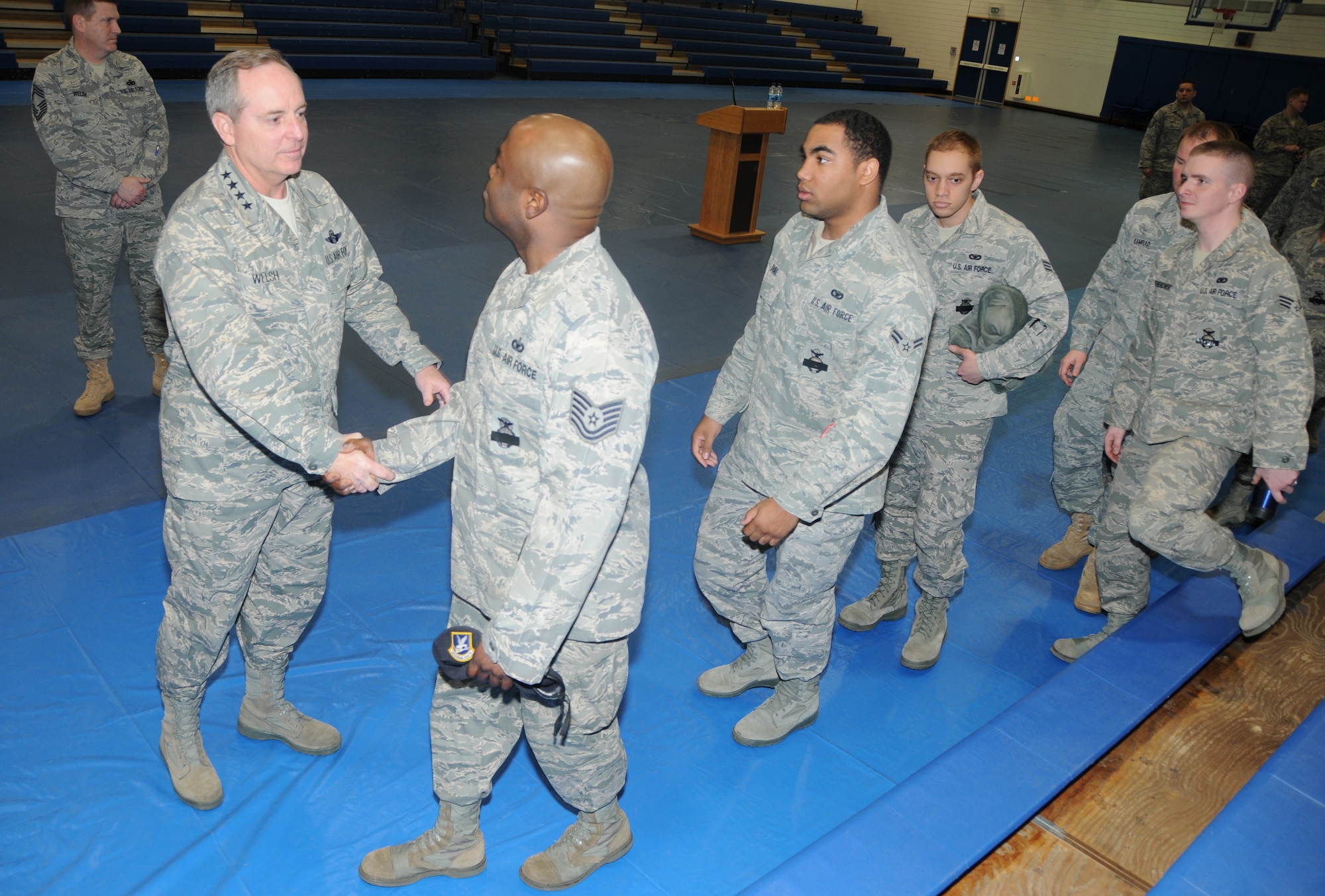 ROYAL AIR FORCE LAKENHEATH, England -- Gen. Mark A. Welsh III, U.S. Air Forces in Europe commander, shakes hands with Airmen from the 48th Security Force Squadron on March 3. After talking to more than 200 Airmen about the shooting incident that claimed the life of one 48th SFS Airman and left two other wounded, General Welsh shook the hand of every Airman in attendance. (U.S. Air Force photo/Staff Sgt. Stephen Linch)