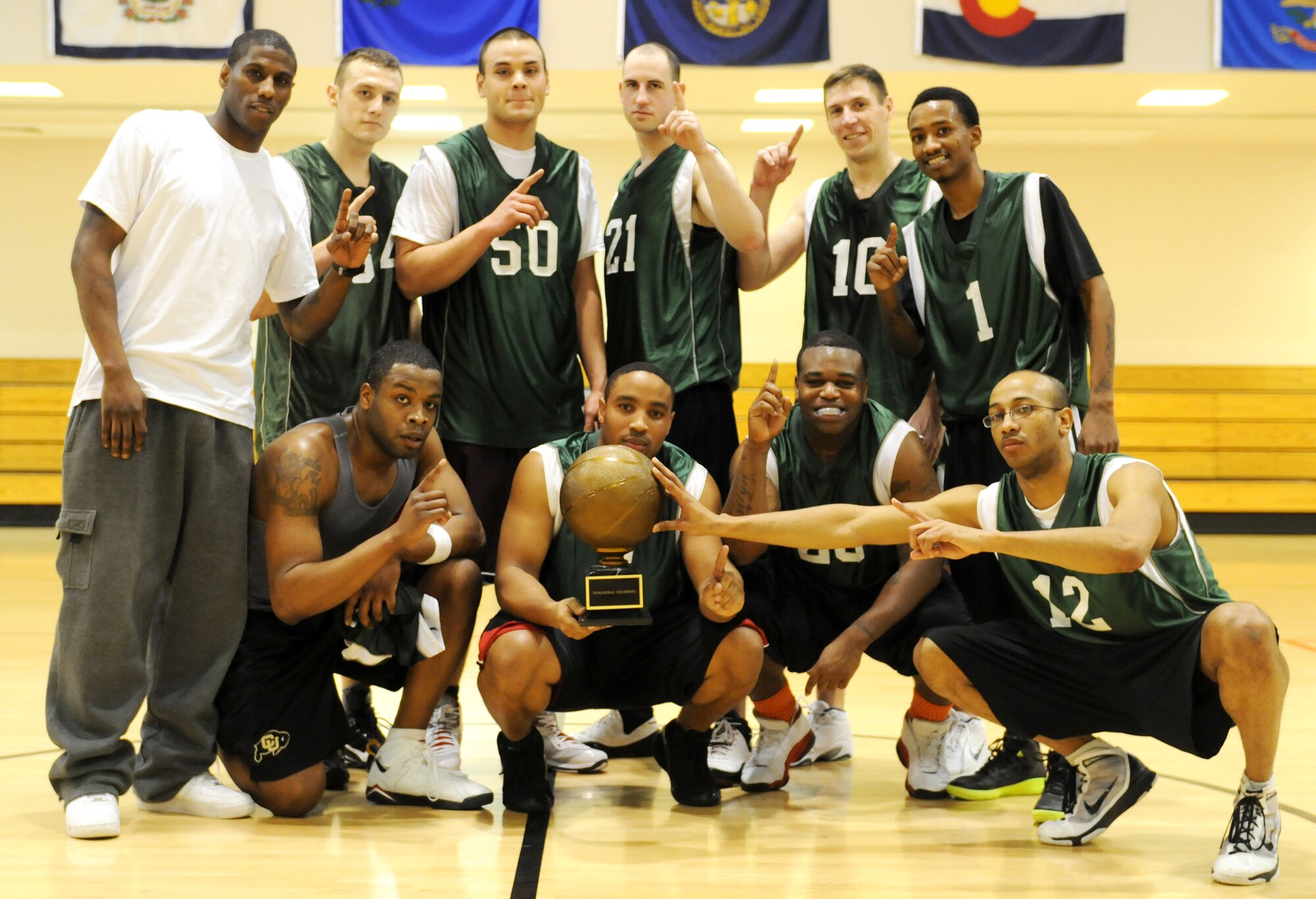 RAF MILDENHALL, England -- The 100th Logistics Readiness Squadron poses for a group photo after winning the RAF Mildenhall 2011 Intramural Basketball Championship Feb. 4 at the Hardstand Fitness Center.  The 100th LRS beat the 100th Maintenance Group 70-53. (U.S. Air Force photo/Senior Airman Tabitha M. Lee)