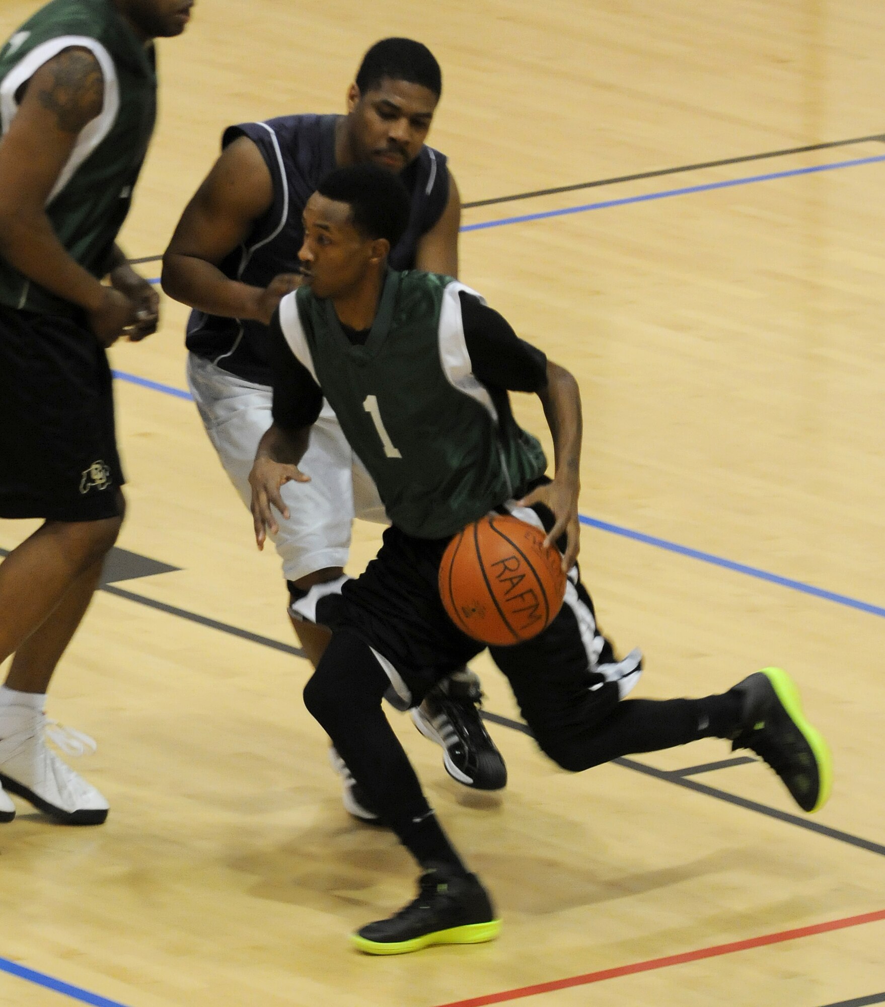 RAF MILDENHALL, England -- Dustin Rice, presses toward the goal during the RAF Mildenhall 2011 Intramural Basketball Championship Feb. 4 at the Hardstand Fitness Center.  The game ended with a final score of 70-53, 100th LRS over 100th MXG. (U.S. Air Force photo/Senior Airman Tabitha M. Lee)