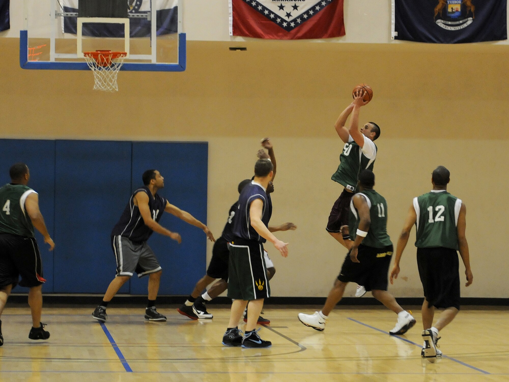 RAF MILDENHALL, England -- Thomas Smith, 100th Logistics Readiness Squadron, shoots for 2 points during the RAF Mildenhall 2011 Intramural Basketball Championship Feb. 4 at the Hardstand Fitness Center.  The game ended with a final score of 70-53, 100th LRS over 100th MXG. (U.S. Air Force photo/Senior Airman Tabitha M. Lee)