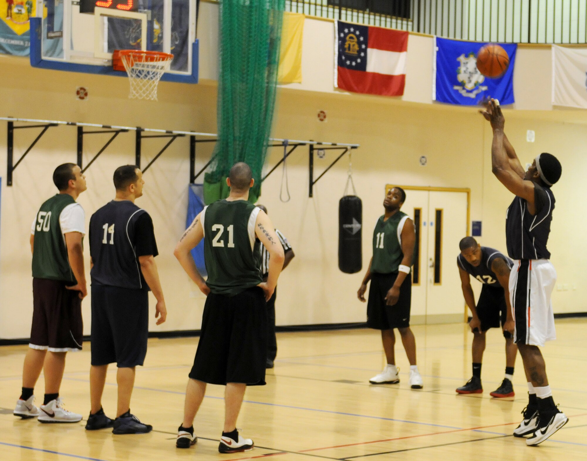 RAF MILDENHALL, England -- Jonnie Story, 100th Maintenance Squadron, shoots a free throw during the RAF Mildenhall 2011 Intramural Basketball Championship Feb. 4 at the Hardstand Fitness Center. The game ended with a final score of 70-53, 100th LRS over 100th MXG. (U.S. Air Force photo/Senior Airman Tabitha M. Lee)