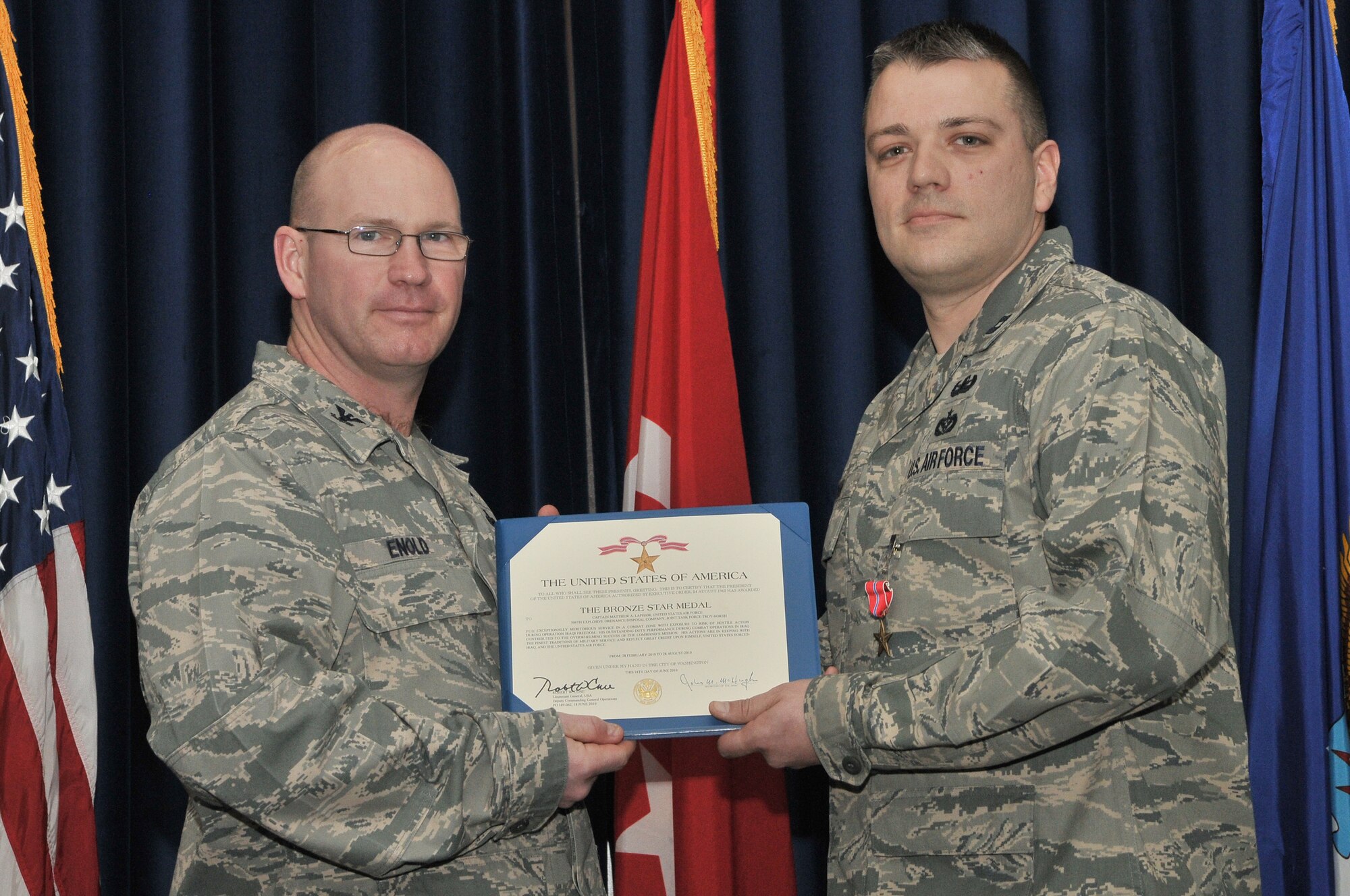 Col. Scott Enold, the 39th Mission Support Group commander, presents the Bronze Star medal to Capt. Matthew Lapham, from the 39th Civil Engineer Squadron, Feb. 17, 2011, at Incirlik Air Base, Turkey. Captain Lapham deployed as the 506th Explosive Ordinance Disposal flight commander and served with Joint Task Force Troy supporting 1st Brigade of the 1st Armored Division. During his time in Iraq he led 32 Airmen, six soldiers, four contractors and two interpreters to complete 597 successful missions. He also supported over 16,000 coalition forces and over one million local civilians across a 42,000 square-mile battle space in Iraq. Captain Lapham’s work with Iraqi Security Forces helped improve and increase Iraqi SF capabilities. (U.S. Air Force photo by Staff Sgt. Alex Montes/Released)