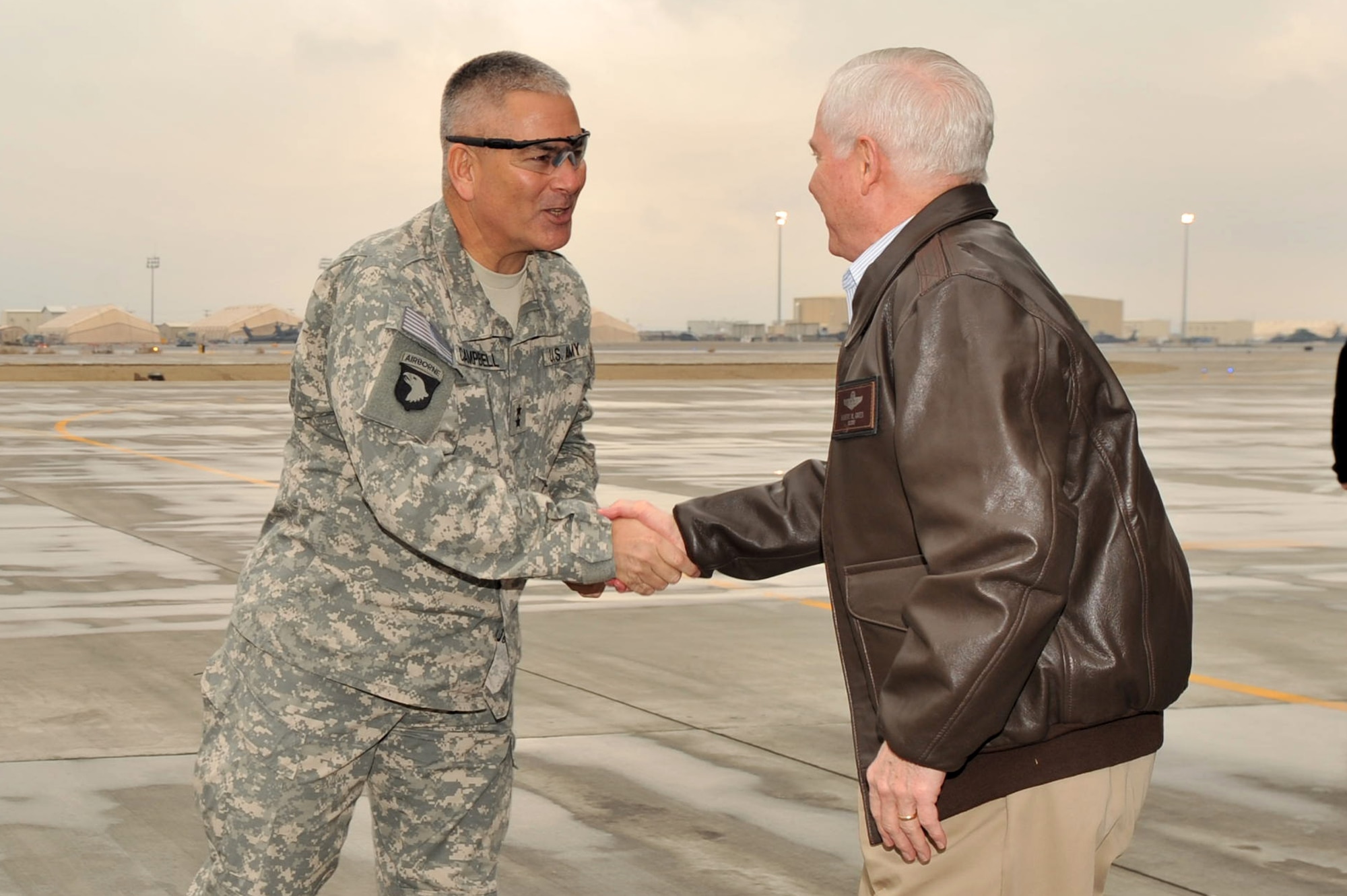 Defense Secretary Robert M. Gates (right) shakes hands with U.S. Army Maj. Gen. John F Campbell, Combined Joint Task Force 101 commanding general, upon his arrival at Bagram Airfield, Afghanistan, March 7, 2011. (U.S. Air Force photo by Senior Airman Sheila deVera)