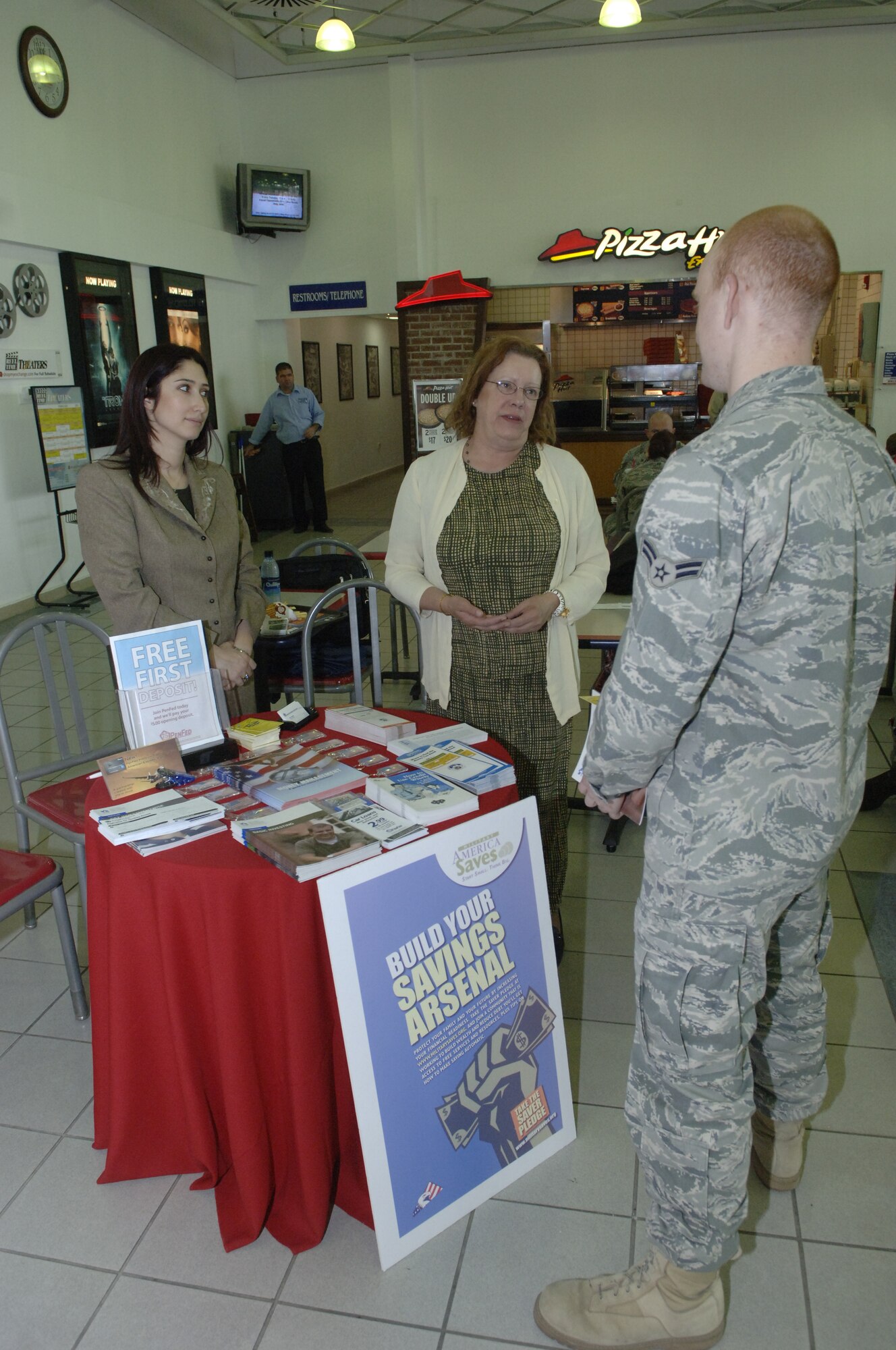 Sharon Proctor, 39th Force Support Squadron community readiness consultant and the Incirlik Military Saves Campaign coordinator, and Esra Fasoldt, Pentagon Federal Credit Union branch manager, give advice to a young Airman at Incirlik Air Base, Turkey, Feb. 23, 2011, during the Military Saves Campaign.  Military Saves, which ran from Feb. 20-27, is a financial readiness initiative endorsed by the Office of the Secretary of Defense and implemented by the Air Force.  This campaign promotes healthy financial habits for Airmen and their family members by creating awareness of the importance of saving to help them reach their financial and personal goals.  (U.S. Air Force photo by Senior Airman Anthony J. Hyatt/Released)