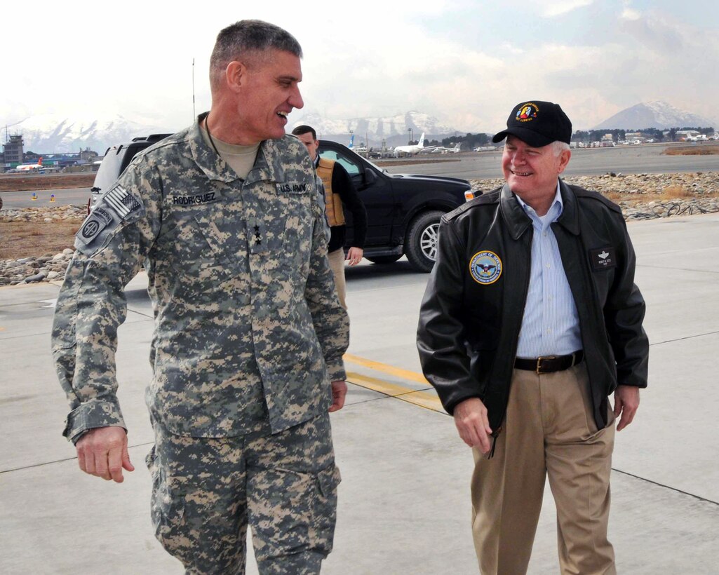 U.S. Defense Secretary Robert M. Gates and U.S. Army Lt. Gen. David M. Rodriguez, commander of International Security Assistance Force Joint Command Afghanistan, chat on the flightline in Kabul, Afghanistan, March 7, 2011.