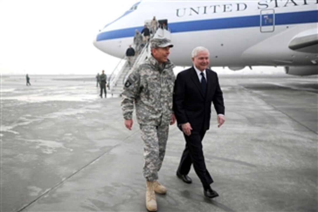 Secretary of Defense Robert M. Gates is greeted by Gen. David Petreaus after his arrival in Kabul, Afghanistan, on March 7, 2011.  
