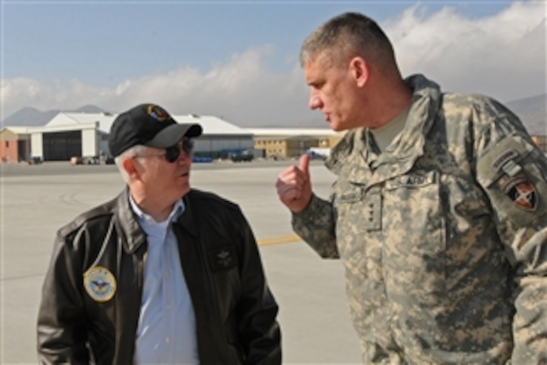 U.S. Defense Secretary Robert M. Gates receives an update from Army Lt. Gen. David M. Rodriguez, commander of the International Security Assistance Force Joint Command Afghanistan, in Kabul, Afghanistan, March 7, 2011. Gates is there to visit troops, meet with Afghan President Hamid Karzai and talk with NATO military leaders about progress being made toward transitioning security responsibility to Afghan forces, set to start in July. 