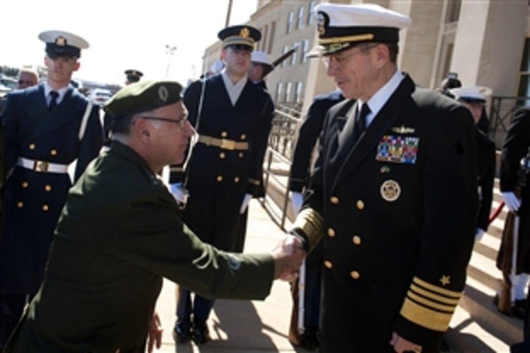 U.S. Navy Adm. Mike Mullen, chairman of the Joint Chiefs of Staff, welcomes Brazilian Armed Forces Joint Staff Chief Gen. Jose Carlos DiNardi outside the Pentagon, March 7, 2011.