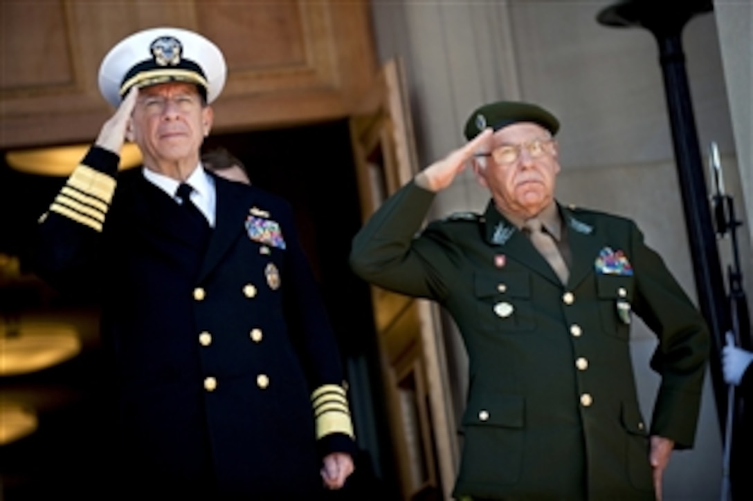 U.S. Navy Adm. Mike Mullen, chairman of the Joint Chiefs of Staff, and Brazilian Armed Forces Joint Staff Chief Gen. Jose Carlos DiNardi salute during the playing of their national anthems at a welcoming ceremony for DiNardi at the Pentagon, March 7, 2011.
