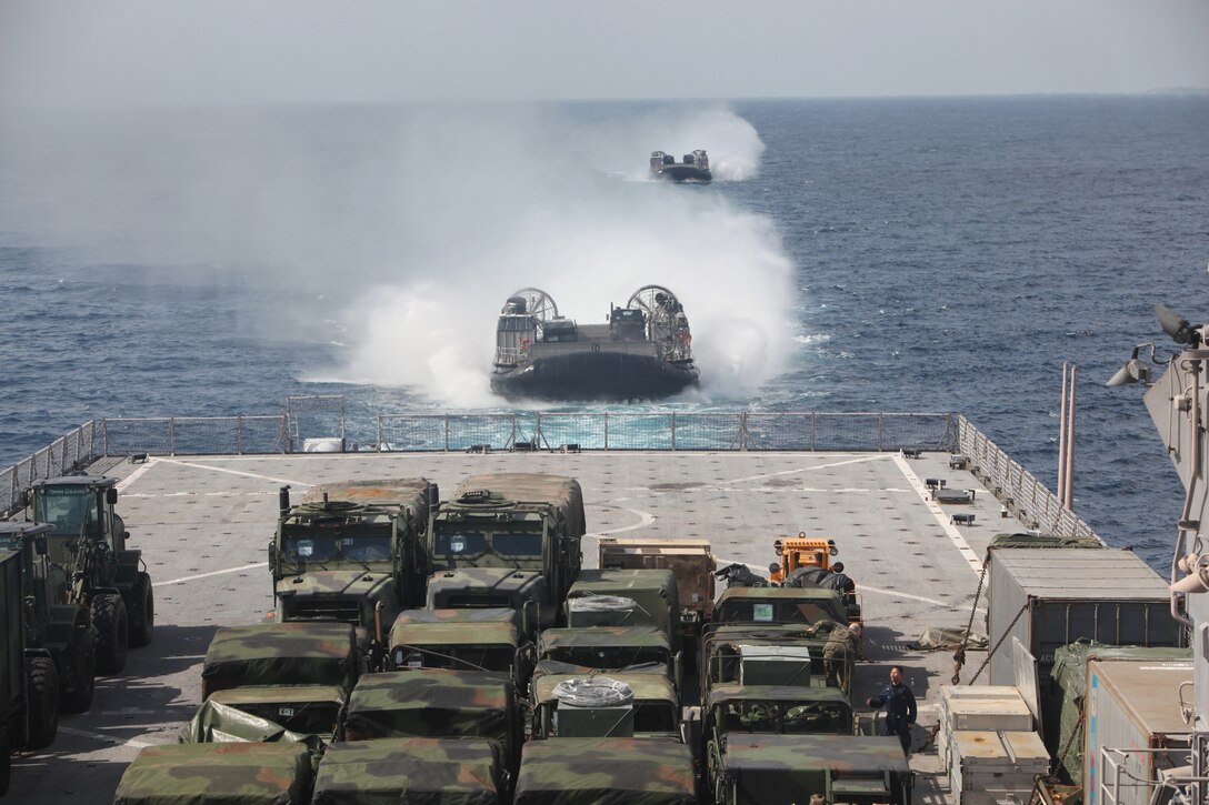 Two U.S. Navy landing craft air cushioned, carrying vehicles and equipment of Combat Logistics Battalion 31, 31st Marine Expeditionary Unit, approach the stern of the USS Harpers Ferry (LSD 49) at sea, March 8.  Elements of the 31st MEU are embarked aboard the USS Harpers Ferry (LSD 49) for the MEU’s scheduled patrol of the Asia-Pacific region, enhancing theater security and conducting bilateral training with multiple partner nations.  The 31st MEU is the U.S.’s only continually forward-deployed MEU, and remains a force-in-readiness in the Asia-Pacific region at all times.