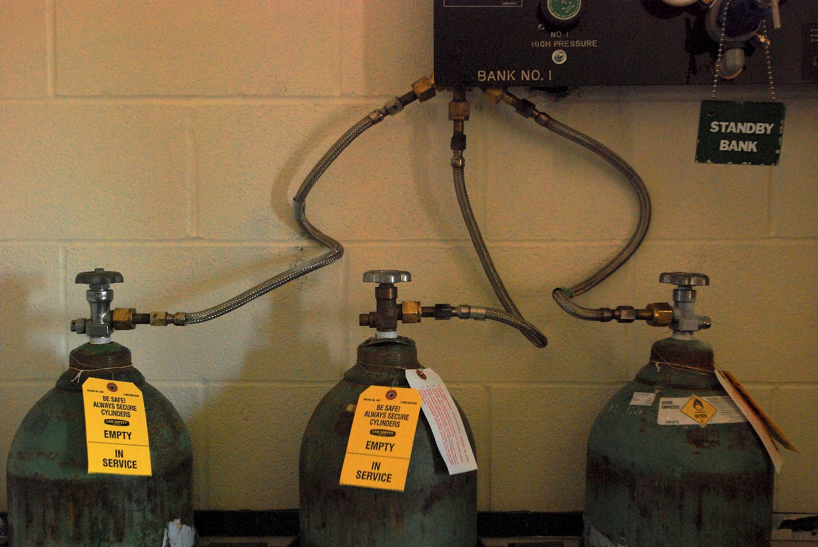 Cylinders containing the oxygen used for breathing during altitude training. The 359th Aeromedical Squadron, Randolph Air Force Base, Texas, uses a hypobaric chamber to train air crew and pilots about the dangers and symptoms of hypoxia, or altitude sickness. Pure oxygen is preferred over the nitrogen-rich air found closer to sea level because of the dangers of breathing nitrogen at abnormally high and low barometric pressure. 
(U. S. Air Force photo/Brian McGloin)