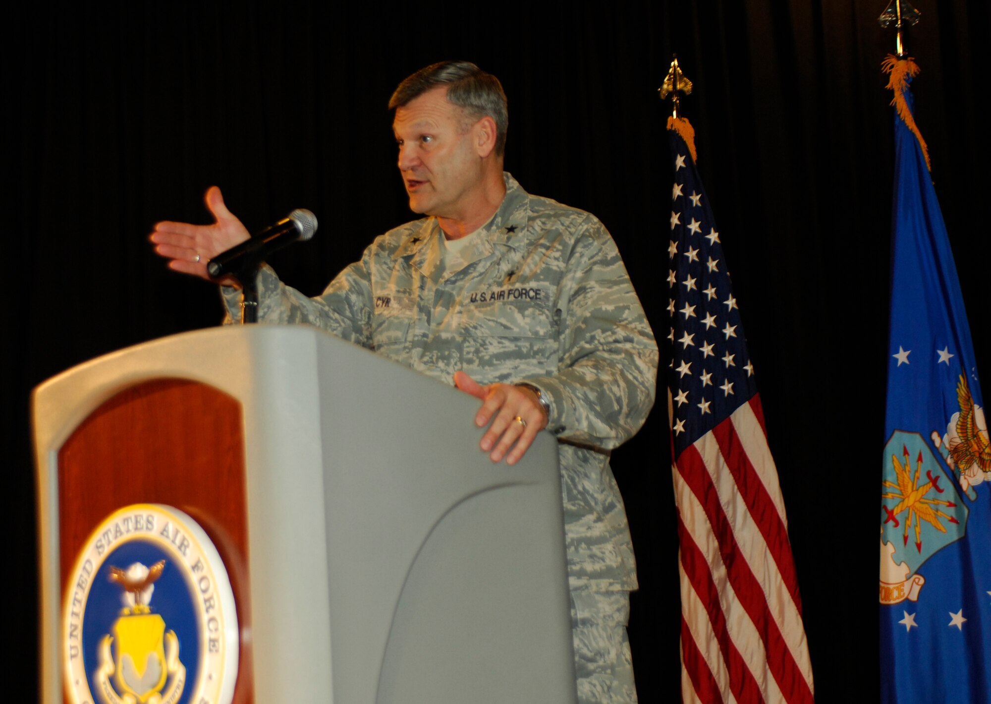 Chaplain (Brig. Gen.) David Cyr (right) relates a story about faith during the National Prayer Luncheon at the Deel Community Center March 4, 2011. Chaplain Cyr, the Air Force deputy chief of chaplains, was the guest speaker for the event. (U.S. Air Force photo/ Staff Sgt. J.G. Buzanowski)