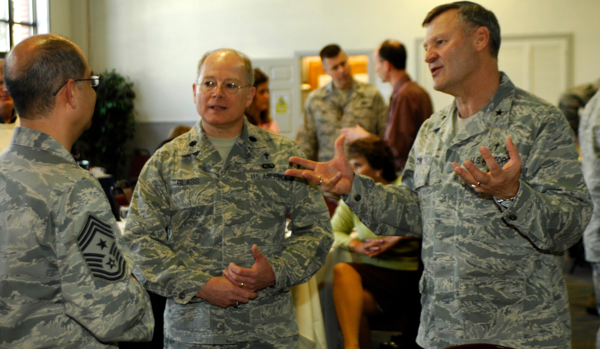 Chaplain (Brig. Gen.) David Cyr (right) relates a story about faith during the National Prayer Luncheon at the Deel Community Center March 4, 2011. Chaplain Cyr, the Air Force deputy chief of chaplains, was the guest speaker for the event. (U.S. Air Force photo/ Staff Sgt. J.G. Buzanowski)