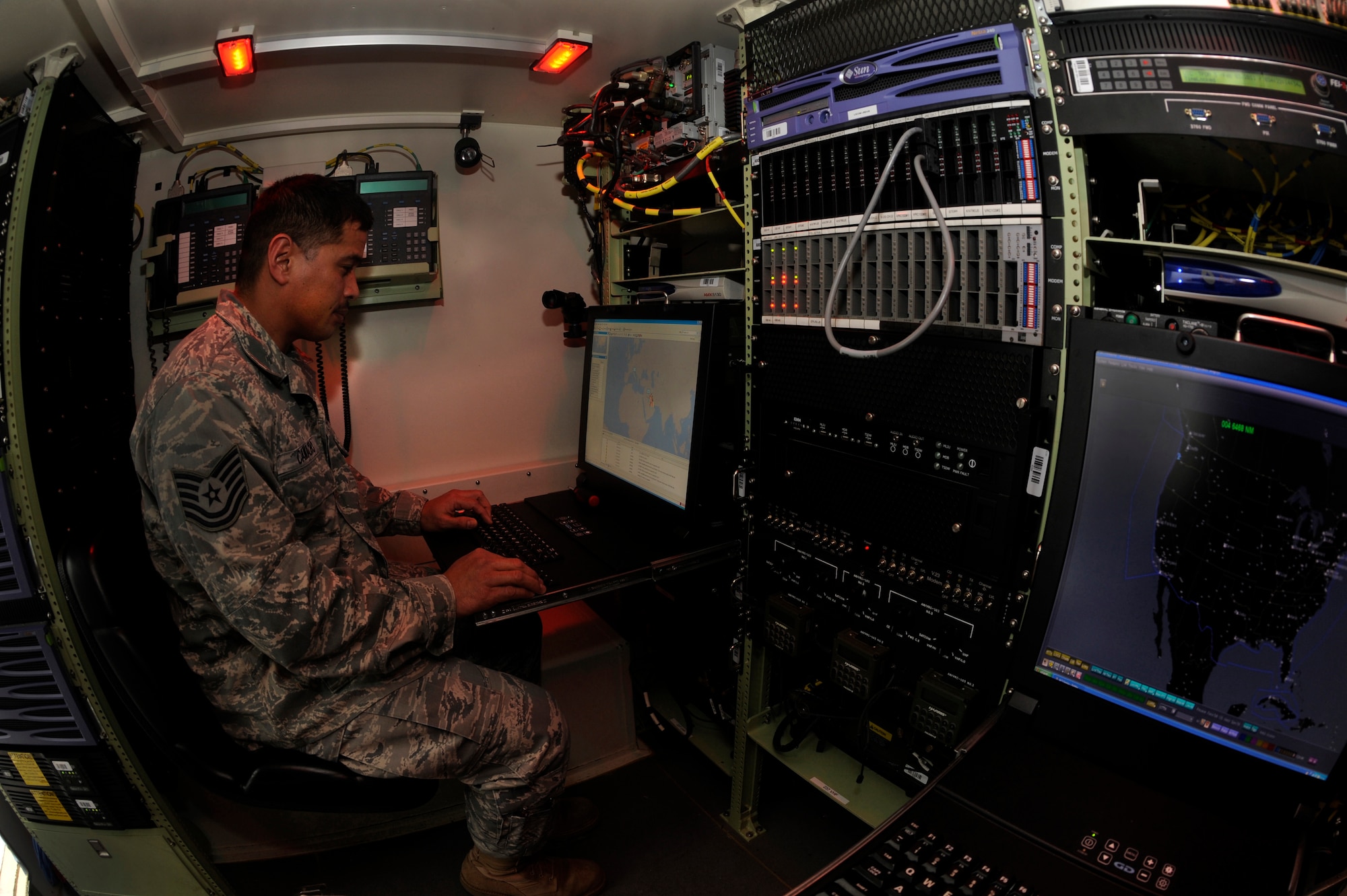 Oregon Air National Guard Tech. Sgt. Ricardo Camacho of the 116th Air Control Squadron operates in a network cyber transport computer during pre-deployment training in preporation for Operation Enduring Freedom, at Camp Rilea, Ore., on February 3, 2001. Camacho is about to embark on his second deployment to the Middle East and has been with the 116th since 2007. (U.S. Air Force photograph by Tech. Sgt. John Hughel, 142nd Fighter Wing Public Affairs)