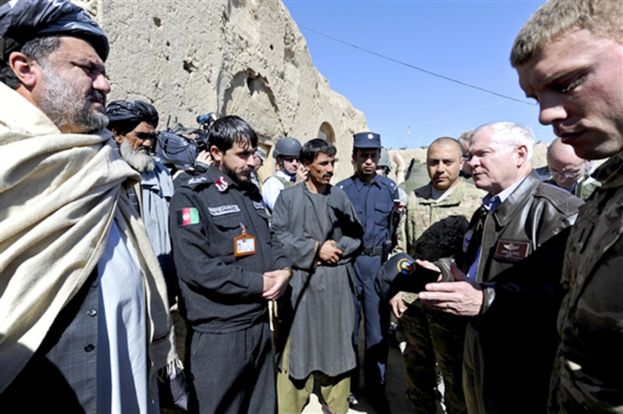 Defense Secretary Robert M. Gates (2nd from right) speaks with elders, members of the village council and the district police chief March 8, 2011, during a village visit outside Combat Outpost Kowall in southern Afghanistan. (Defense Department photo/Cherie Cullen)