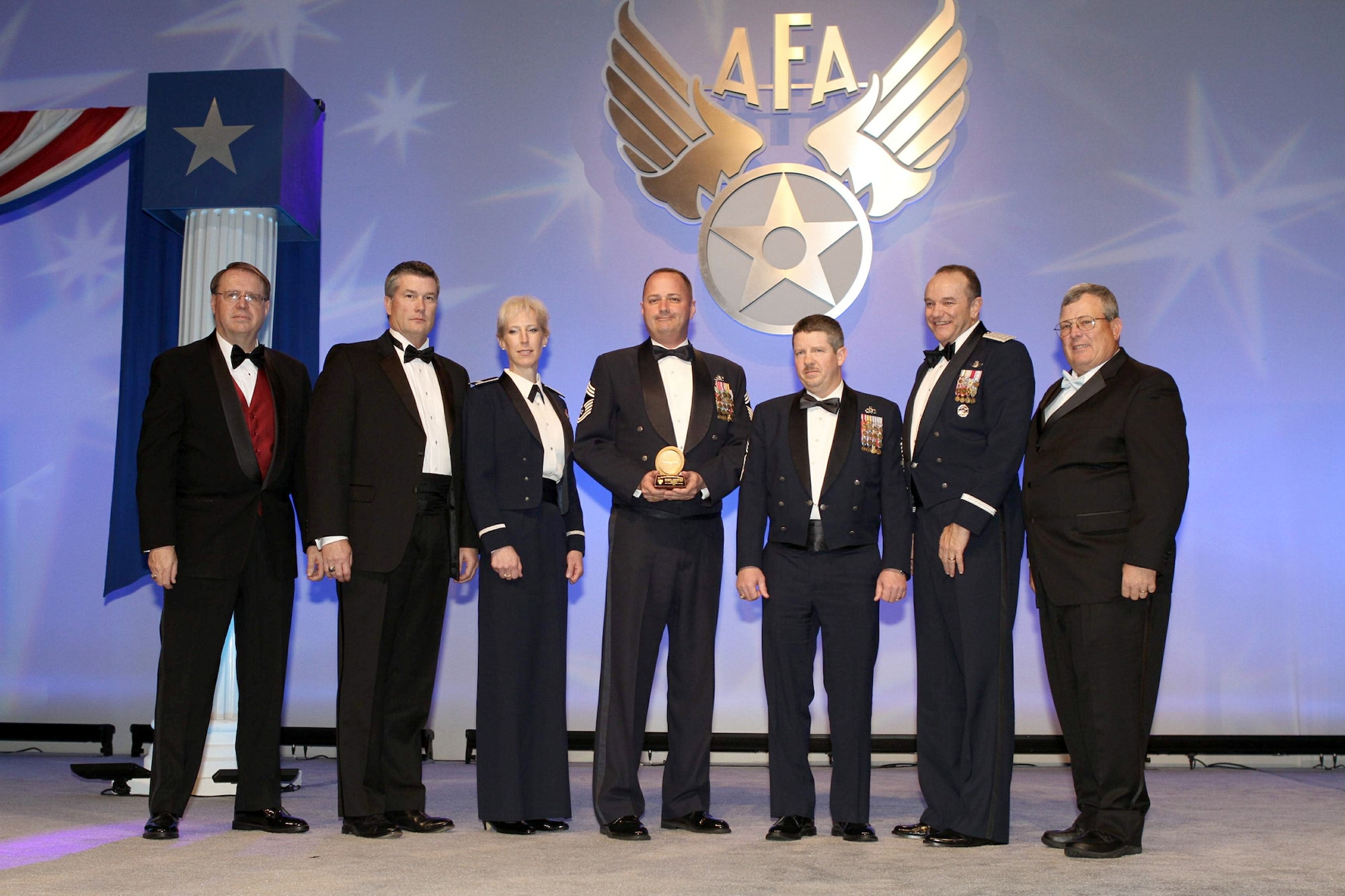 Four civil engineers were designated as Ira Eaker Historical Fellows by the Air Force Association Feb. 18, 2011 in Orlando, Fla at the organization's 20th Anniversary of Operation Desert Storm gala. From left are Tim Brock, Air Force Gala chairman; retired Air Force Col. Marvin Fisher; Col. Elizabeth Brown, Air Force Associate Civil Engineer; Chief Master Sgt. Thomas Gilpin, 436th Civil Engineer Squadron, Dover Air Force Base, Del.; Chief Master Sgt. Carey Casey, 49th Materiel Maintenance Squadron, Holloman AFB, N.M.; Gen. Philip Breedlove, Air Force vice chief of staff; and Central Florida AFA Chapter President William Yucuis. (U.S. Air Force Photo Courtesy of AFA)