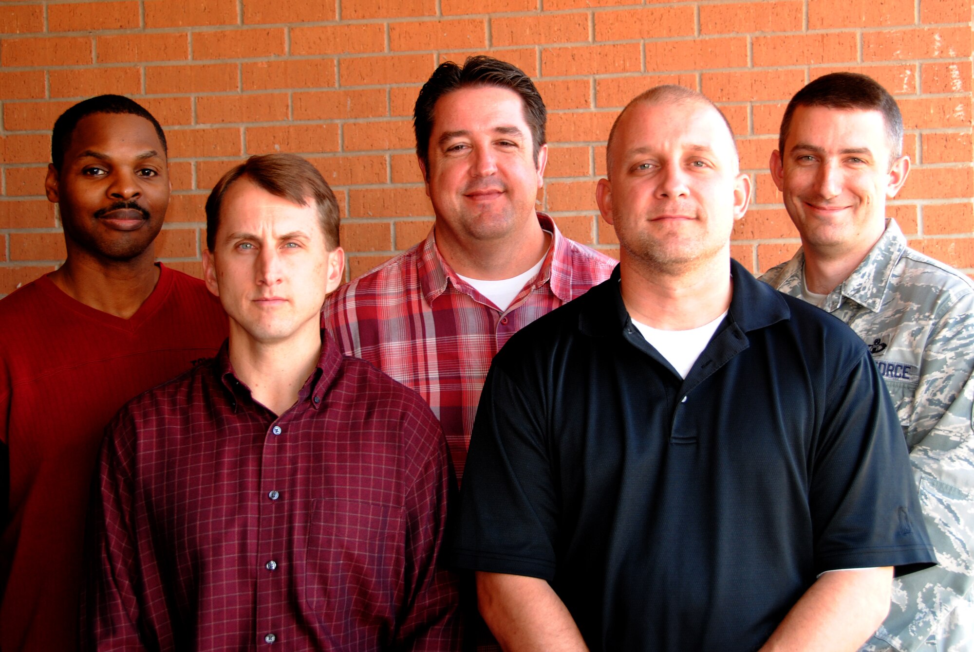 Eleven members of the 71st Operations Support Squadron and the 71st Communication Squadron were selected Warriors of the Week. They are, from left, Joe Williams, Jim Schlecht, Rob Ochs, John Robinson and Master Sgt. Ryan Edwards. Not pictured are Jody Bailey, Mike Lavoie, Woody Crise, Tech. Sgt. Peter Abernethy, Staff Sgt. Justin Cheeks and Jim Murray. (U.S. Air Force photo)
