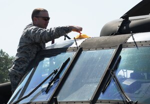 SOTO CANO AIR BASE, Honduras - Capt. Matthew Deufemia, Civil Engineer Flight commander, 612th Air Base Squadron, pre-positions a fire simulator devise prior to the kick-off of a no-notice exercise here March 8. U.S. forces at Soto Cano Air Base train to ensure the highest levels of proficiency and readiness are maintained, guaranteeing preparation for any mission, emergency or crisis throughout the region. (U.S. Air Force photo/Staff Sgt. Kimberly Rae Moore)