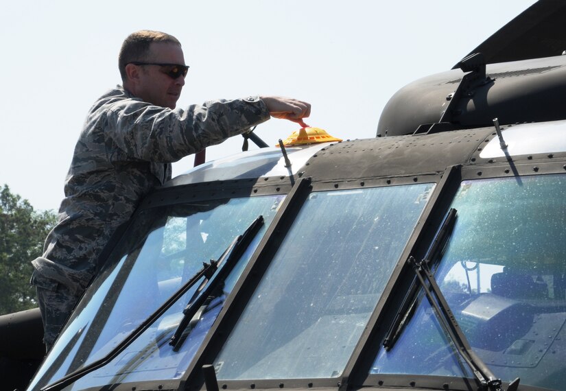 SOTO CANO AIR BASE, Honduras - Capt. Matthew Deufemia, Civil Engineer Flight commander, 612th Air Base Squadron, pre-positions a fire simulator devise prior to the kick-off of a no-notice exercise here March 8. U.S. forces at Soto Cano Air Base train to ensure the highest levels of proficiency and readiness are maintained, guaranteeing preparation for any mission, emergency or crisis throughout the region. (U.S. Air Force photo/Staff Sgt. Kimberly Rae Moore)