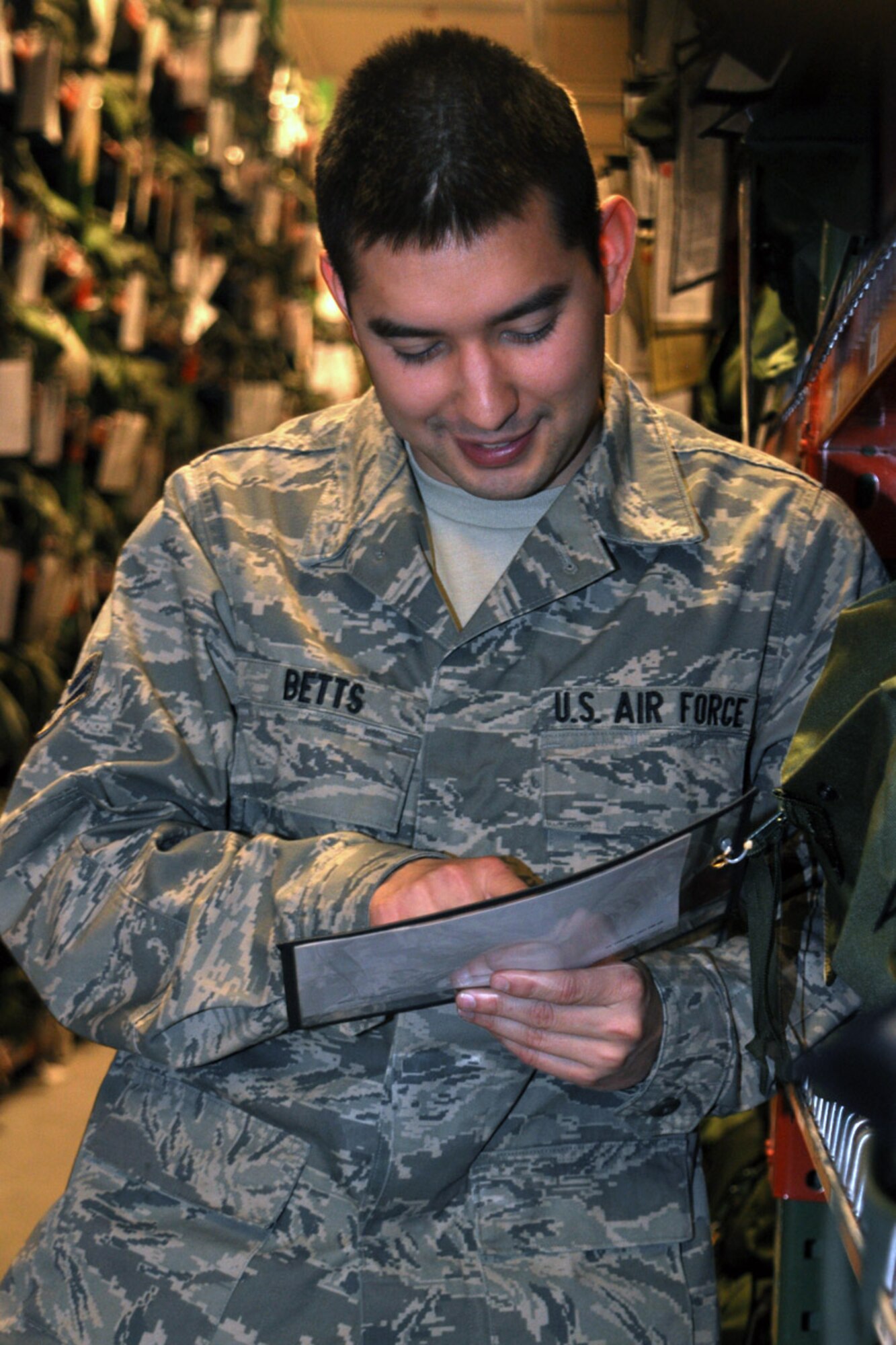 Airman 1st Class Jesse Betts, 419th Logistics Readiness Squadron, inventories mobility gear at Building 900. (U.S. Air Force photo/Staff Sgt. Heather Skinkle)