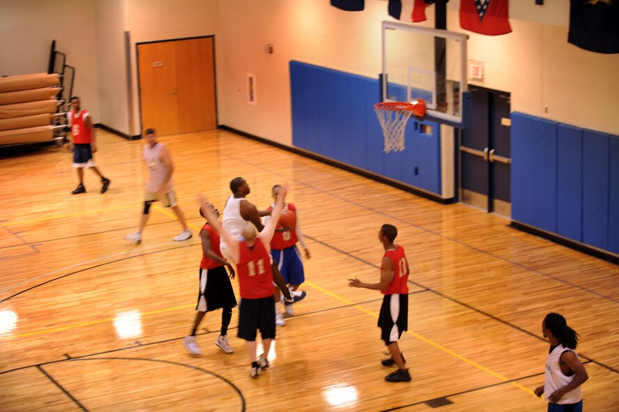 MOODY AIR FORCE BASE, Ga. -- Blake Williams, 23rd Force Support Squadron team member, attempts a layup through four defenders during the championship intramural basketball game March 7. Though he was heavily guarded, Williams still managed to make the shot. (U.S. Air Force photo/Airman 1st Class Douglas Ellis)(RELEASED)
