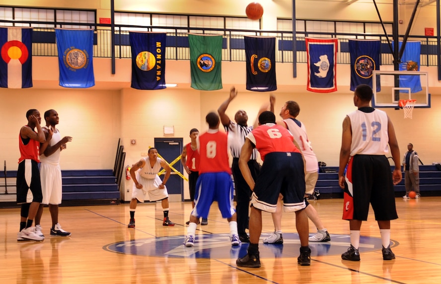 MOODY AIR FORCE BASE, Ga. -- The 23rd Force Support Squadron and 822nd Base Defense Squadron prepare to win the opening tip-off during an intramural basketball game March 7. This was the championship game of the season and both teams battled back and forth throughout the game. (U.S. Air Force photo/Airman 1st Class Douglas Ellis)(RELEASED)

