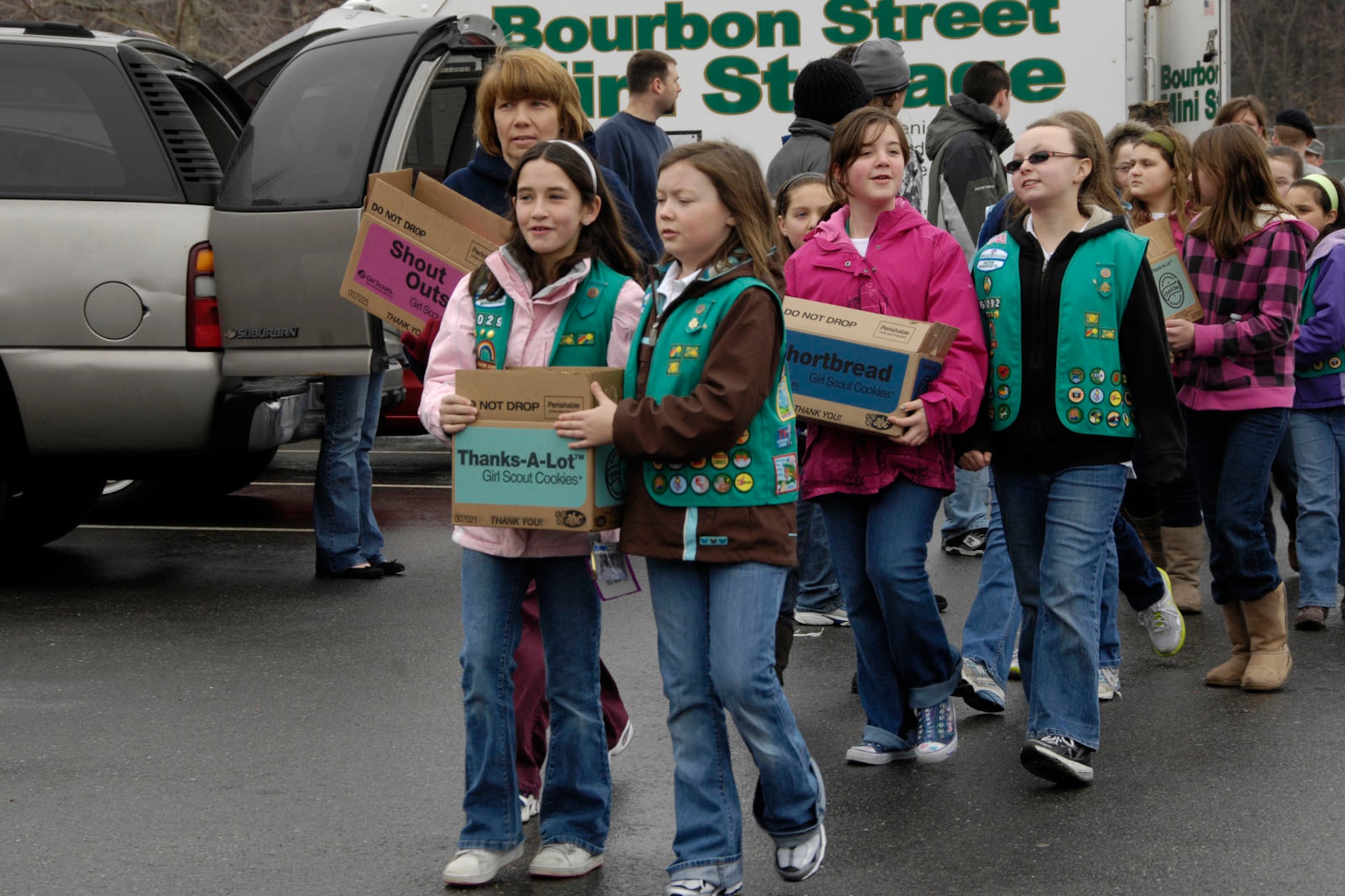 HANSCOM AIR FORCE BASE, Mass. – Girl Scout troops prepare to drop off cookies that will be sent to troops overseas during Operation Cookie Drop on March 5. More than 1,500 Girl Scouts dropped off approximately 30,000 boxes of cookies to 11 troop-focused non-profit organizations and military and federal government agencies during the one-day event. (U.S. Air Force photo by Linda LaBonte Britt)