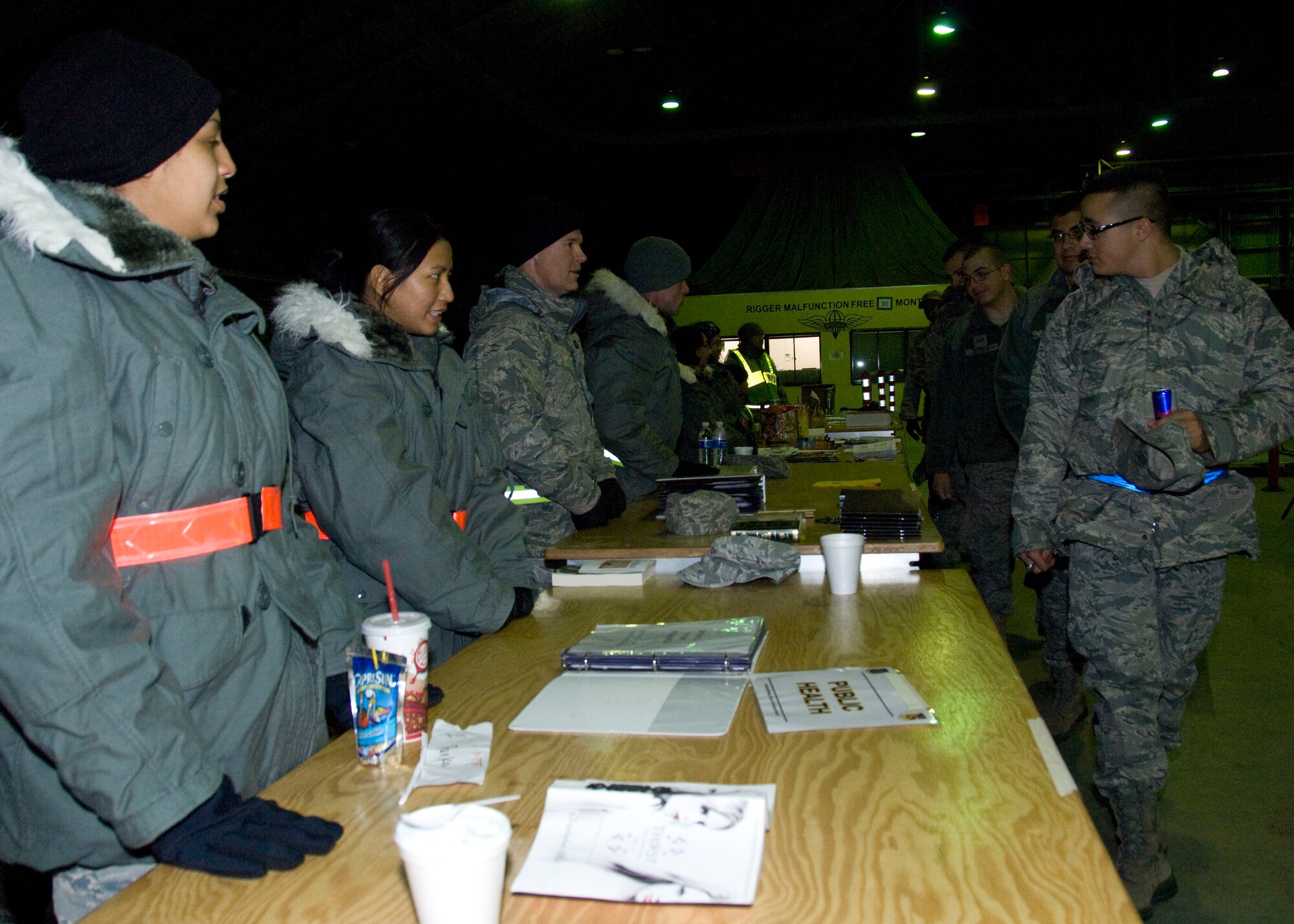 YOKOTA AIR BASE, Japan -- Airmen transition through the deployment processing line during Operational Readiness Exercise here March 8. The processing line gathers specialists from various organizations around Yokota to provide every deploying member with individual assistance ensuring all of their affairs are in order prior to departing on the deployment. (U.S. Air Force photo/Airman 1st Class Andrea Salazar)