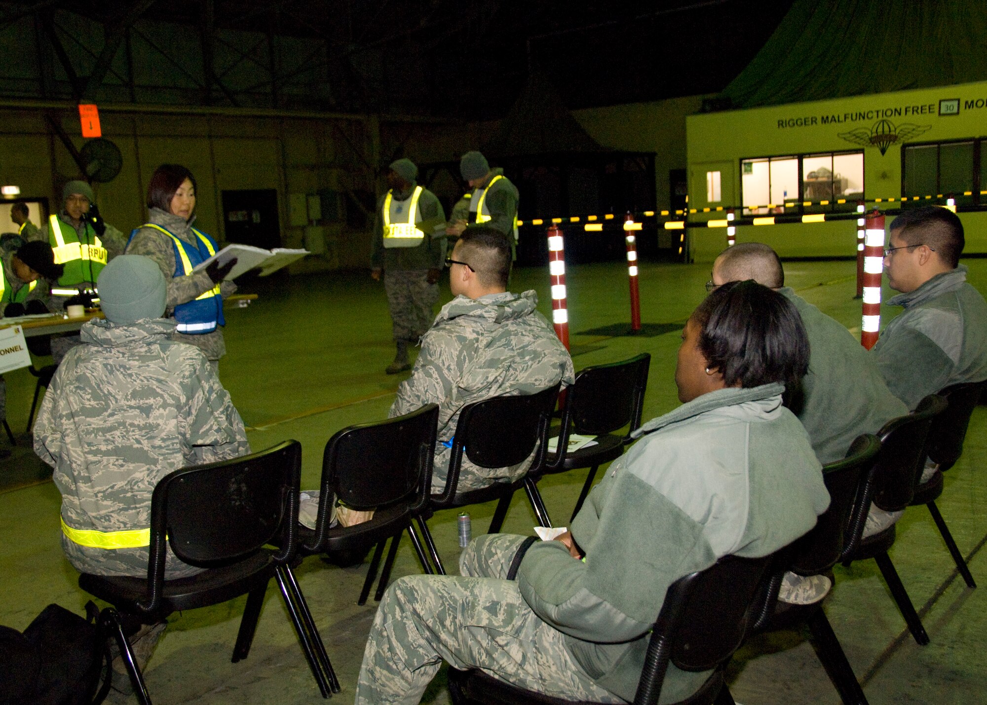 YOKOTA AIR BASE, Japan -- 2nd Lt. Angela Cho, 374th Force Support Squadron reception processing unit officer in charge, briefs personnel processing through the deployment line during an Operational Readiness Exercise here March 8. Yokota Airmen practice mission support skills necessary to support Airmen deploying for real-world contingencies. (U.S. Air Force photo/Airman 1st Class Andrea Salazar)