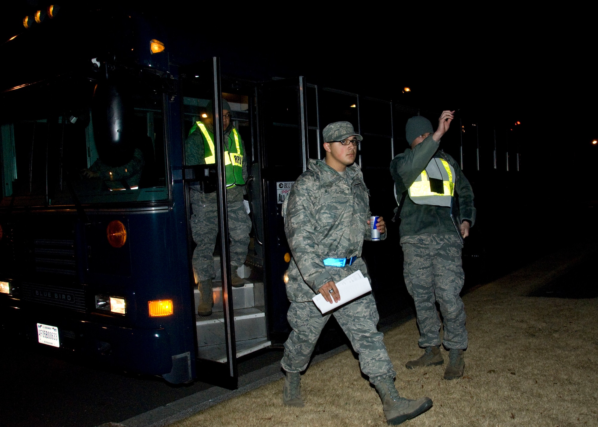 YOKOTA AIR BASE, Japan -- Airmen from the 374th Airlift Wing exit a bus during an Operational Readiness Exercise here March 8. The exercise included Airmen from units assigned to the 374th AW and is conducted to maintain readiness. (U.S. Air Force photo/Airman 1st Class Andrea Salazar)