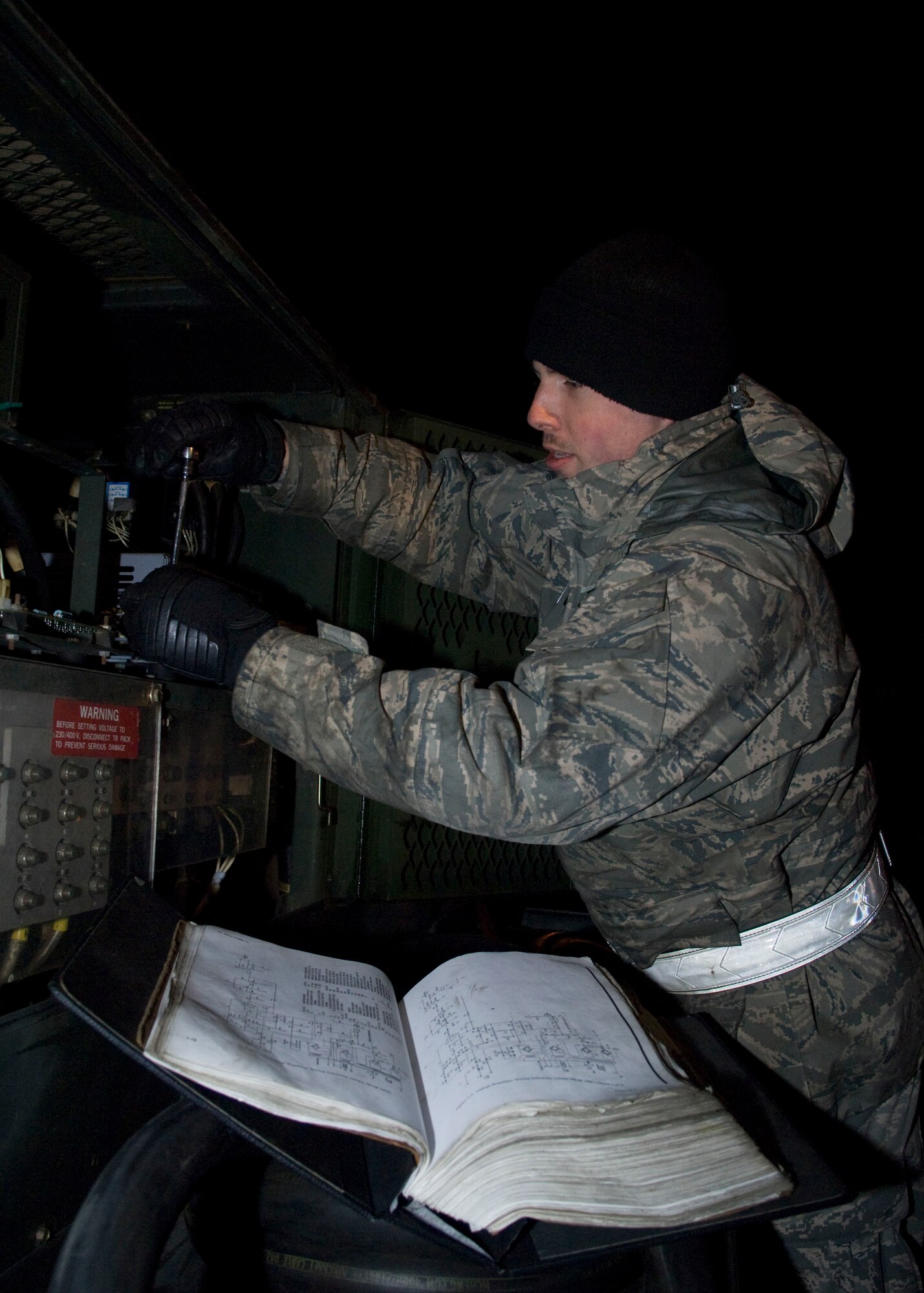 YOKOTA AIR BASE, Japan -- Staff Sgt. Jeff Van Stone, 374th Maintenance Squadron aerospace ground equipment journeyman, performs routine maintenance on a voltage regulator during an Operational Readiness Exercise here March 8. Preventive maintenance helps reduce the corrosion of equipment and sustains operations. (U.S. Air Force photo/Airman 1st Class Andrea Salazar)