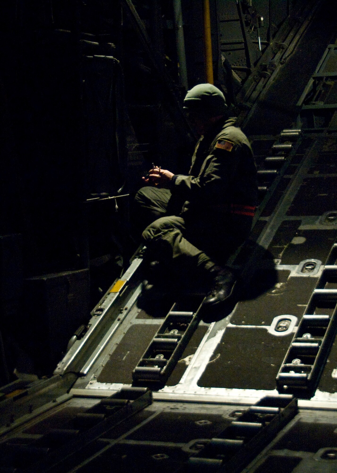 YOKOTA AIR BASE, Japan -- Staff Sgt. Jace Hartog, 36th Airlift Squadron loadmaster, secures loose items onboard a C-130 Hercules during an Operational Readiness Exercise here March 7. Loadmasters secure cargo to ensure safe flight operations. The exercise allows Airmen to practice executing their primary duties for real-world contingencies. (U.S. Air Force photo/Airman 1st Class Andrea Salazar)