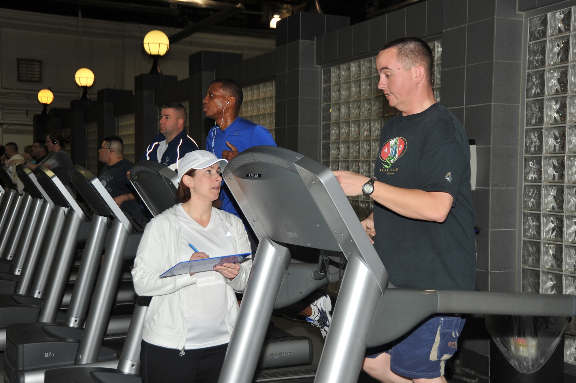 OFFUTT AIR FORCE BASE, Neb. - Marcy Jameson, HAWC Flight Chief & Exercise Physiologist, talks with Senior Airman Justin Speck of the 55th Logistic Readiness Squadron. Airman Speck was a participant in the Get Fit Run class at the Offutt Field House. U.S. Air Force photo by D.P. Heard