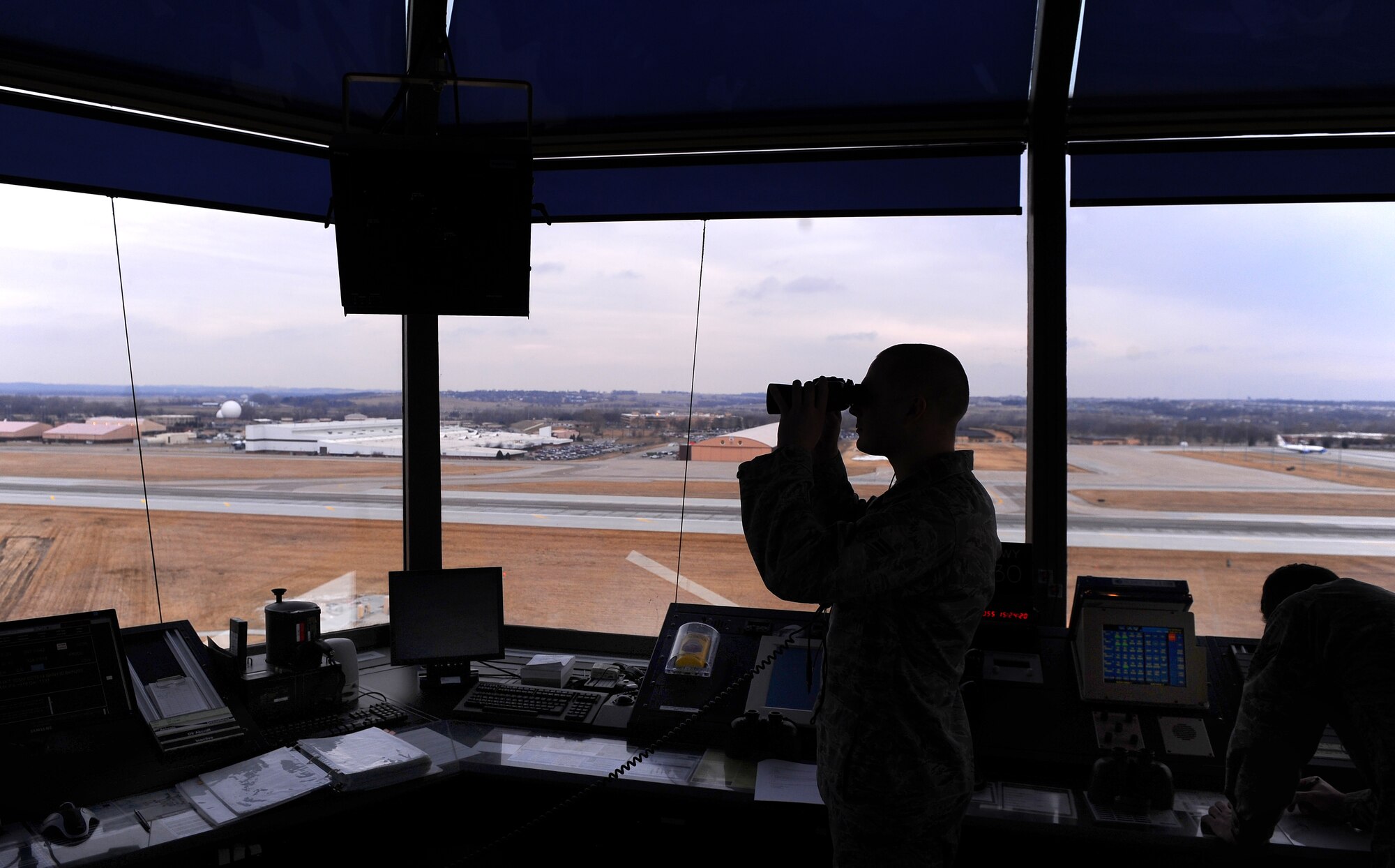 OFFUTT AIR FORCE BASE, Neb. - Airman 1st Class Adam Karre, an air traffic controller apprentice assigned to the 55th Operations Support Squadron, monitors west bound incoming aircraft descending here, Feb. 24. U.S. Air Force Photo by Josh Plueger (Released)
