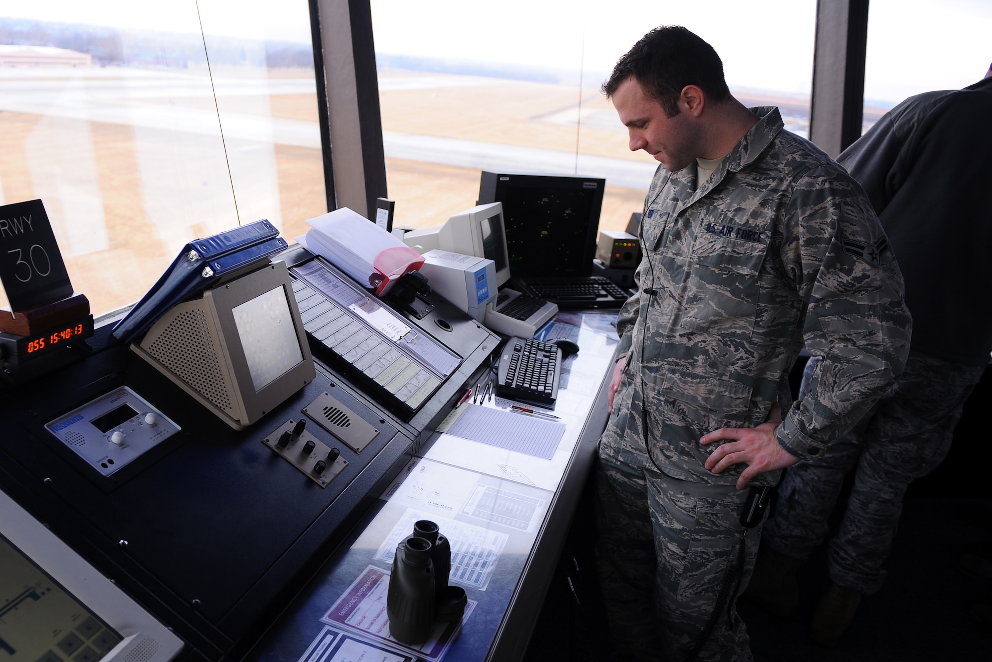 OFFUTT AIR FORCE BASE, Neb. - Airman 1st Class Mike Bier, an air traffic controller apprentice assigned to the 55th Operations Support Squadron, monitors aircraft traffic in and around Offutt, Feb. 24. U.S. Air Force Photo by Josh Plueger (Released)
