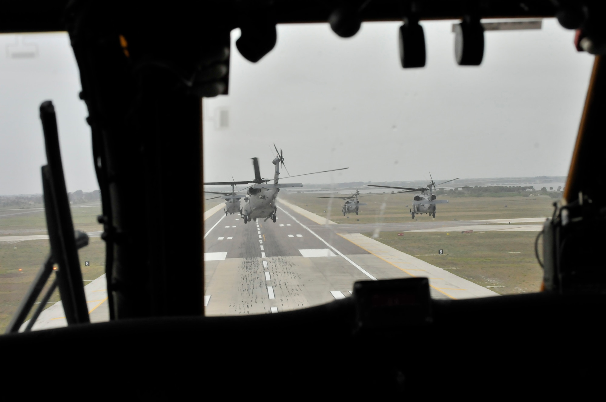 PATRICK AIR FORCE BASE, Fla. - Airmen from the Air Force Reserve's 920th Rescue Wing here took in their HH-60G Pave Hawk helicopters into a thick cloud of rain and mist March 6 when the wing stepped up to the challenge from their commander, Col. Robert Dunn, to launch the wing's entire fleet their drill training weekend. In addition to six pave hawks, three HC-130P/N Kings were airborne. (U.S. Air Force photo/Staff Annamarie Wyant)