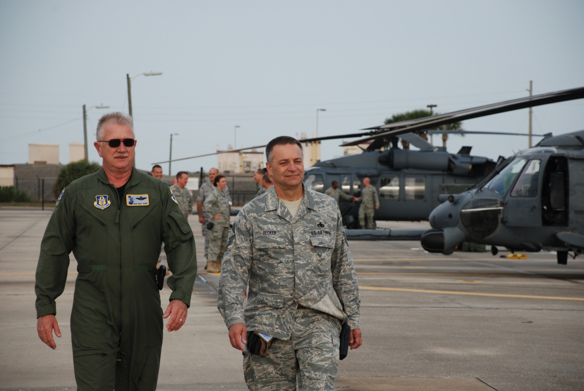PATRICK AIR FORCE BASE, Fla. - Chief Master Sgt. Randy Becker, maintenance superintendent for the 920th Rescue Wing here, walks with Col. Robert Dunn, 920 RQW Commander, during an inspecton March 6 of the entire fleet of six HH-60G Pave Hawk helicopters and three HC-130 King refuelers. After passing inspecton with flying colors, maintenance had success launching the entire fleet of nine aircraft. (U.S. Air Force photo/Capt. Ryan Liss)