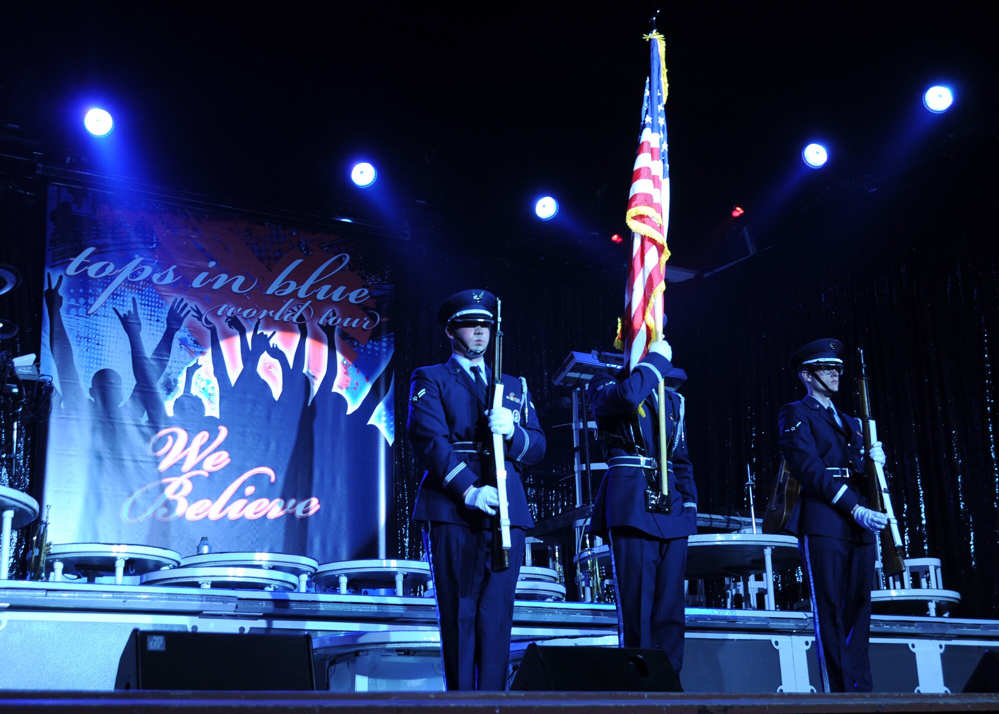 McConnell Honor Guard members present the colors during the National Anthem before the start of the Tops In Blue performance at the Orpheum Theater March 4, 2011, Wichita, Kan. The Tops In Blue’s tour, entitled “We Believe,” featured music from current pop artists to Rhythm and Blues. Tops In Blue tour throughout all 50 states and overseas locations to include Europe, Thailand, the Middle East, Central America and Canada. (U.S. Air Force photo/Senior Airman Maria A. Ruiz)