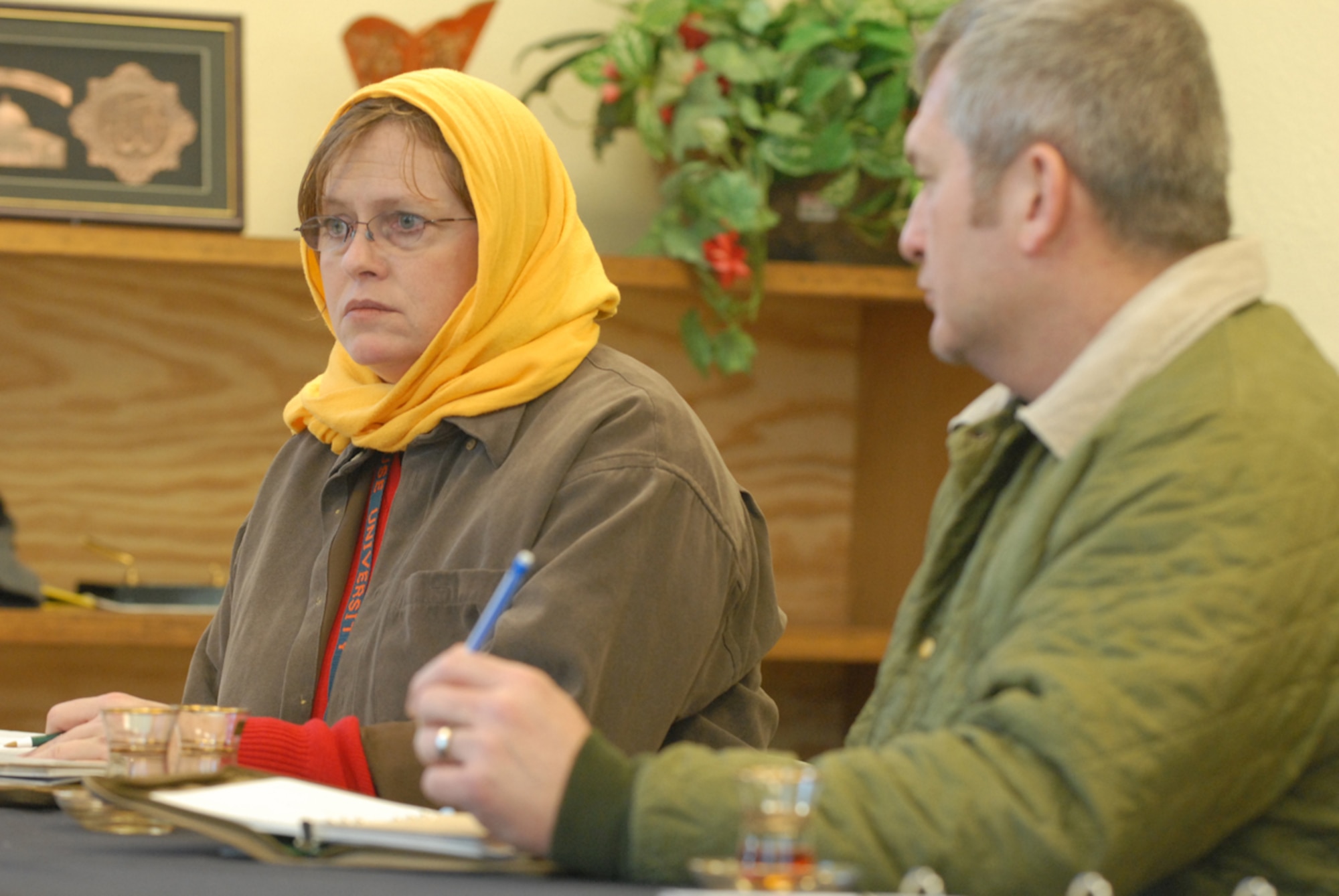 Erin Dunn listens as an “Iraqi official” touches on security and a stalled construction project Feb. 10, 2011, during one of several scenarios students undergo at the 11-day Civilian Expeditionary Workforce predeployment training course at Muscatatuck Urban Training Center, Ind. Ms. Dunn is there to prepare for an upcoming deployment to Iraq.  (Defense Department photo/Elaine Wilson)