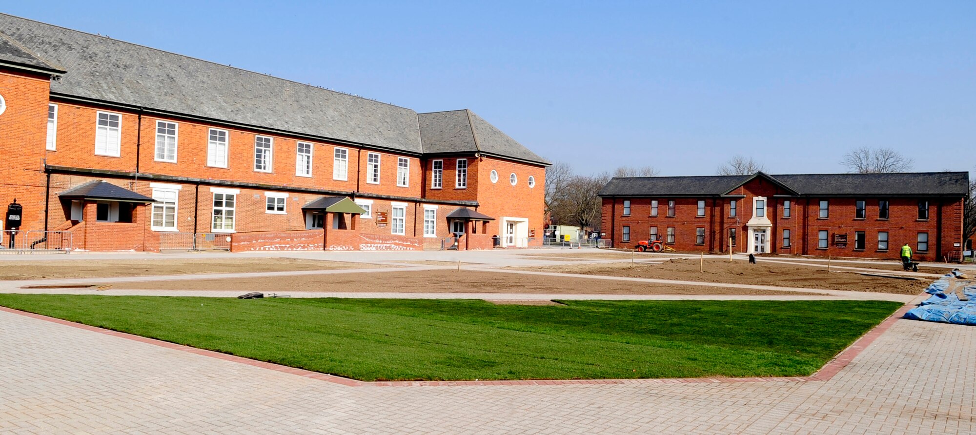 RAF MILDENHALL, England -- Washington Square shows its first signs of green as the landscaping is underway here March 8, 2011. The Washington Square project is in its final stages of its completion. (U.S. Air Force photo/Senior Airman Ethan Morgan)