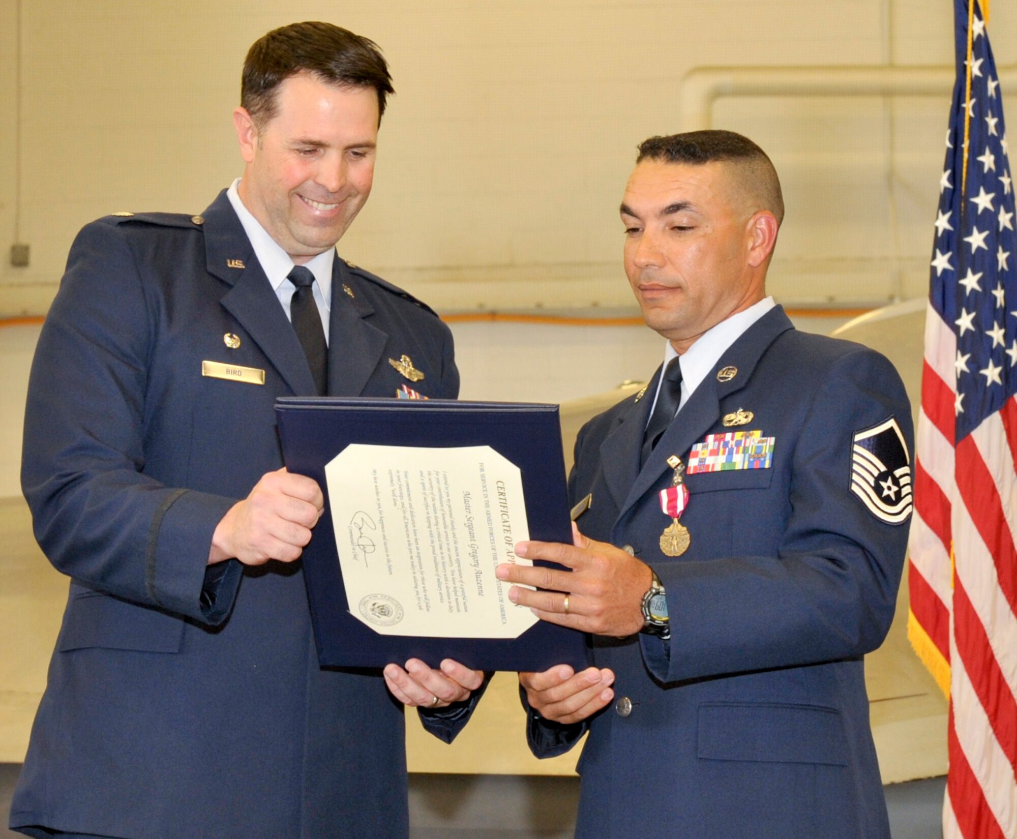 Master Sgt. Greg Auzenne, 43rd Aircraft Maintenance Unit lead production superintendent, accepts his letter of appreciation from Lt. Col. Bradley Bird, 43rd Fighter Squadron commander, March 4 during his retirement ceremony. (U.S. Air Force photo by Jonathan Gibson)