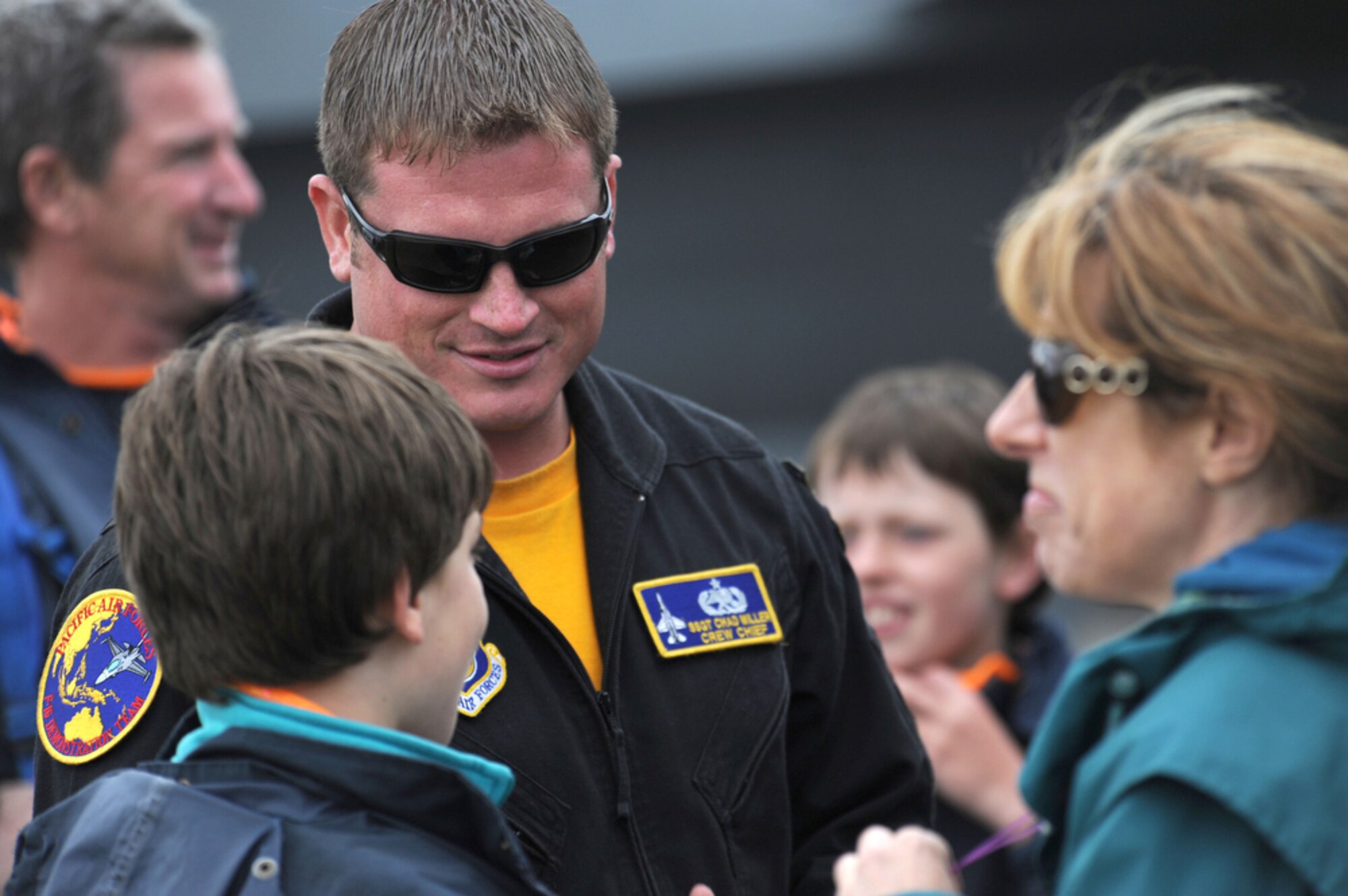 Staff Sgt. Chad Miller interacts with visitors March 4, 2011, at the Avalon 2011 Australian International Airshow in Geelong, Australia. Several U.S. Air Force aircraft were displayed at the event including the F-16 Fighting Falcon, the C-17 Globemaster III, the F-22 Raptor and the C-130J Hercules. The event is one of the largest airshows in the world and coincides with a trade exposition. Sergeant Miller is a crew chief with the F-16 Demonstration Team from Misawa Air Base, Japan. (U.S. Air Force photo/Master Sgt. Cohen A. Young)