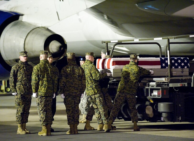 A U.S. Marine Corps carry team transfers the remains of Marine Cpl. Jordan R. Stanton of Rancho Santa Margarita, Calif., at Dover Air Force Base, Del., March 7, 2011.  He was assigned to the 2nd Reconnaissance Battalion, 2nd Marine Division, II Marine Expeditionary Force, Camp Lejeune, N.C.  (U.S. Air Force photo/Jason Minto)