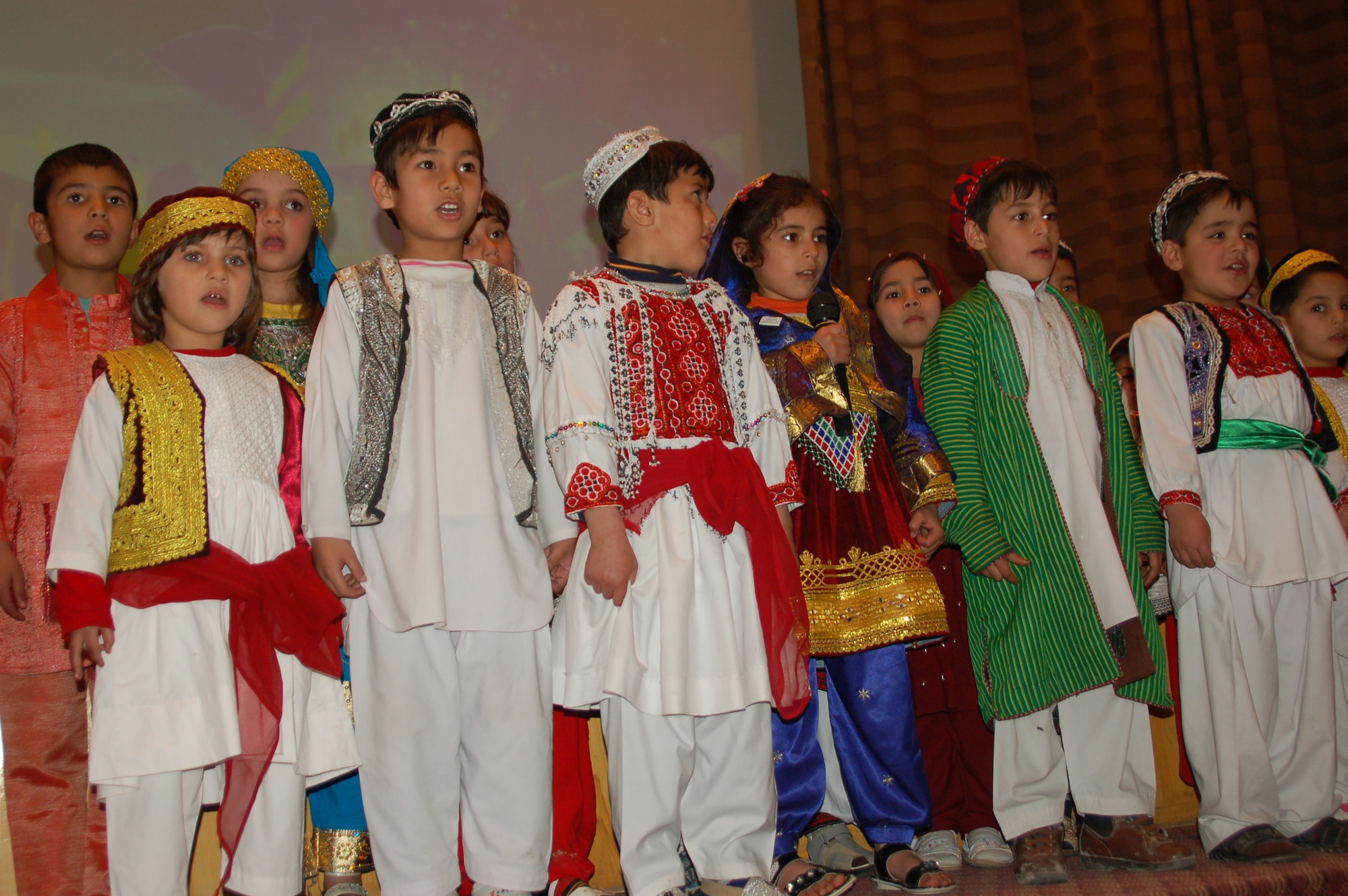 KABUL, Afghanistan - Children from the ANA health department entertained the crowd by singing in both English and Dari languages during the Afghan Ministry of Defense International Women’s day celebration at Sardar Mohammad Dawood Khan hospital on March 7, 2011.  (Afghan Air Force courtesy photo).  